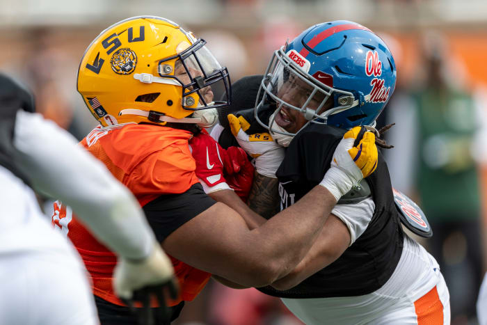 American team offensive lineman Miles Frazier of LSU (70) spars with American team defensive lineman Walter Nolen of Ole Miss (2) during Senior Bowl practice for the American team at Hancock Whitney Stadium. 