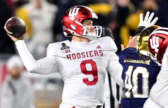 Dec 20, 2024; Notre Dame, Indiana, USA; Indiana Hoosiers quarterback Kurtis Rourke (9) throws during the first half against the Notre Dame Fighting Irish at Notre Dame Stadium.