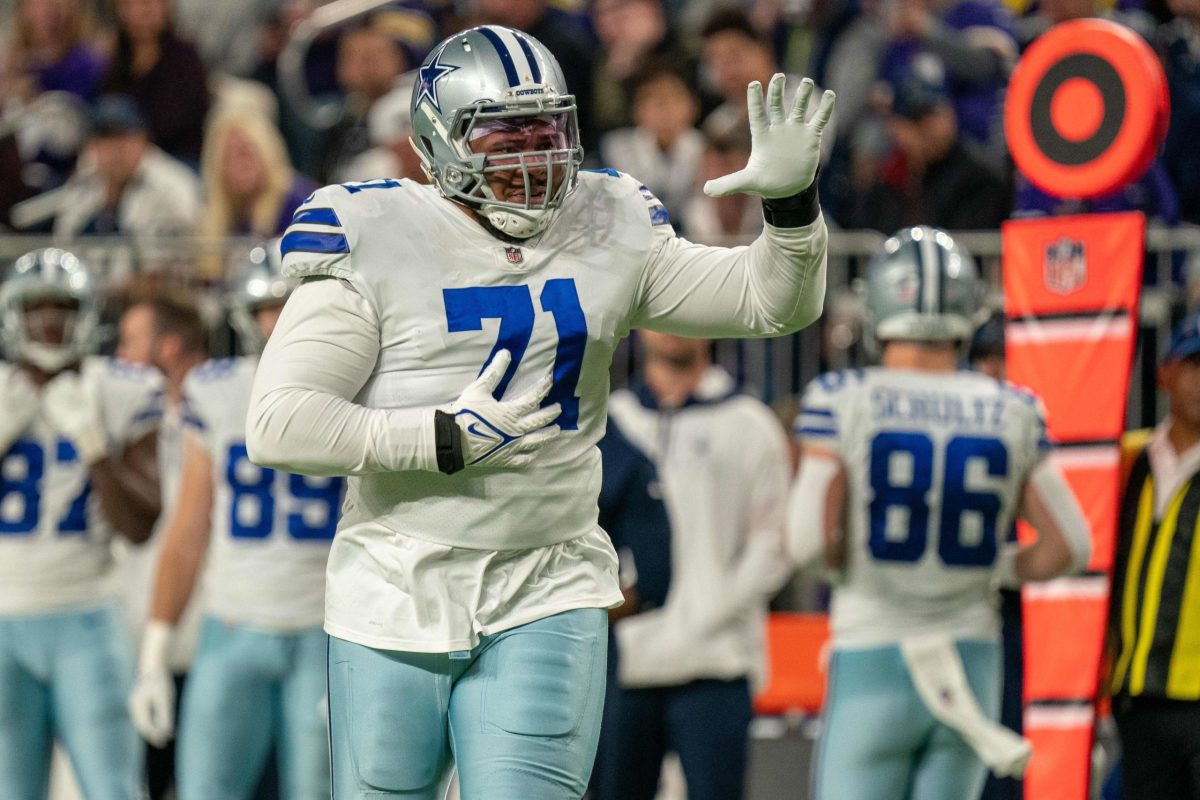 Dallas Cowboys tackle Tyron Smith (77) in action.in an NFL