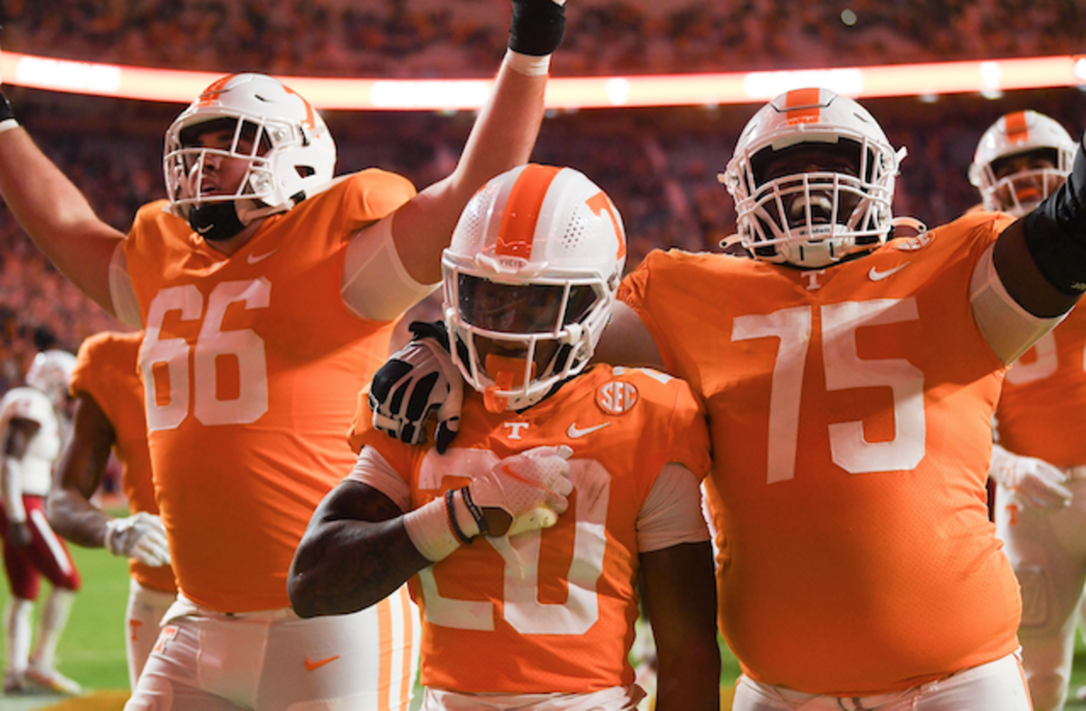 Tennessee Vols players are having fun while holding each other