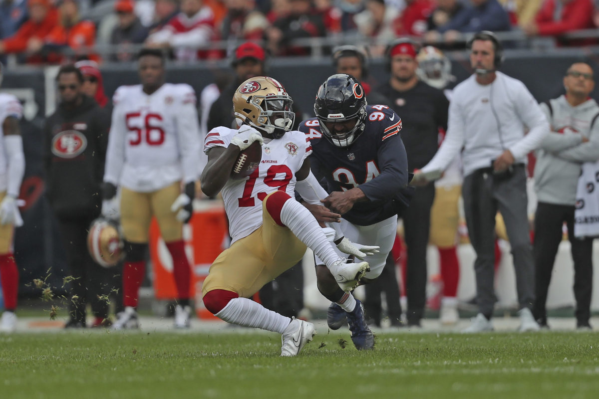 FILE - Chicago Bears linebacker Robert Quinn (94) reacts during