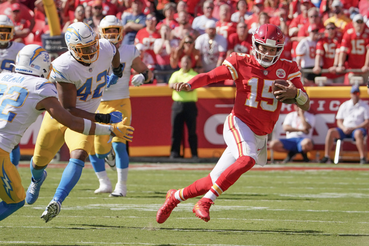 Kansas City Chiefs quarterback Patrick Mahomes (15) runs with the