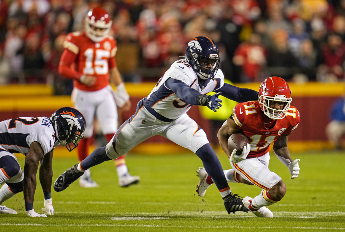 Denver Broncos linebacker Baron Browning (56) runs a play against