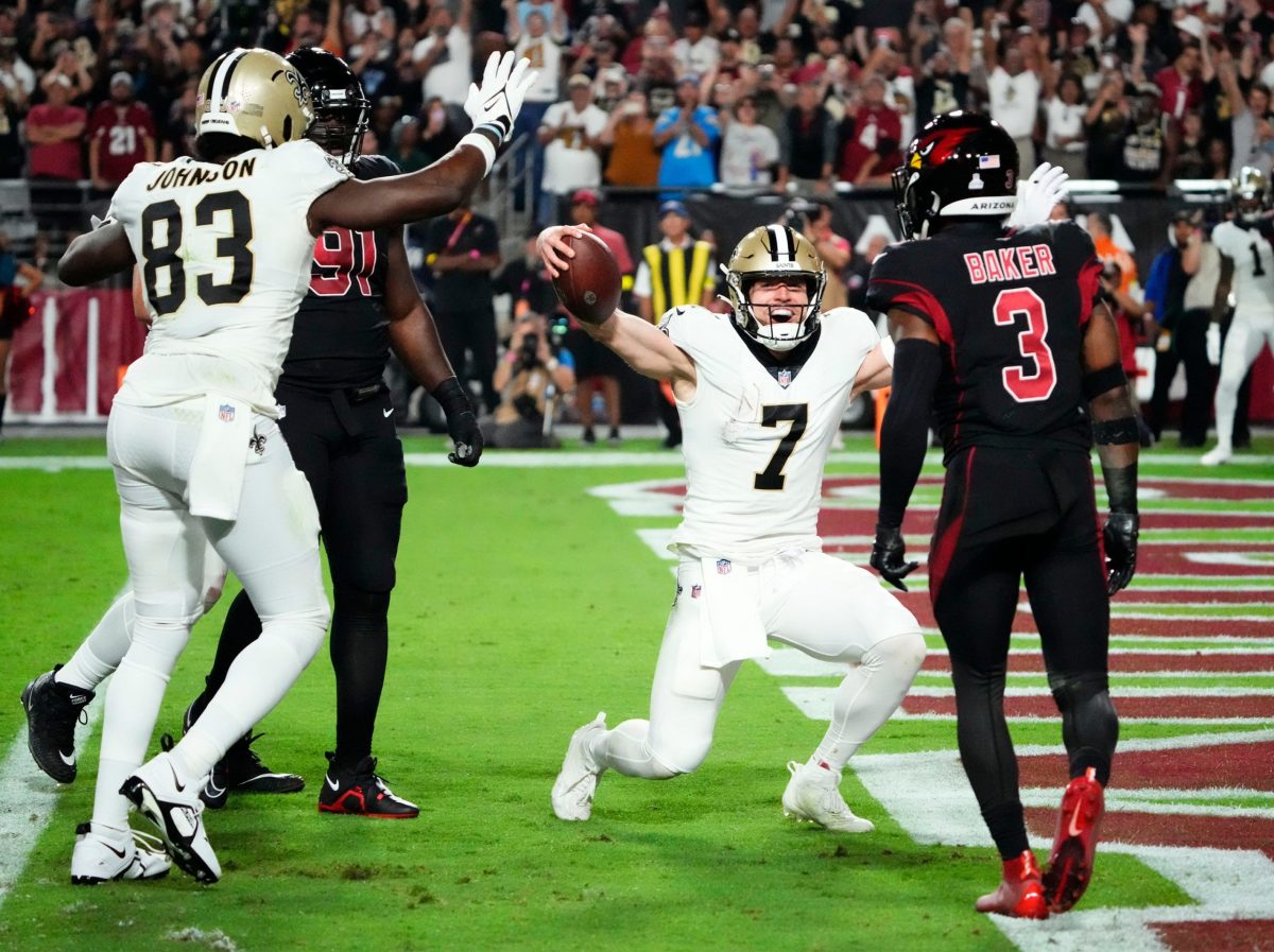 New Orleans Saints quarterback Taysom Hill throws a pass against