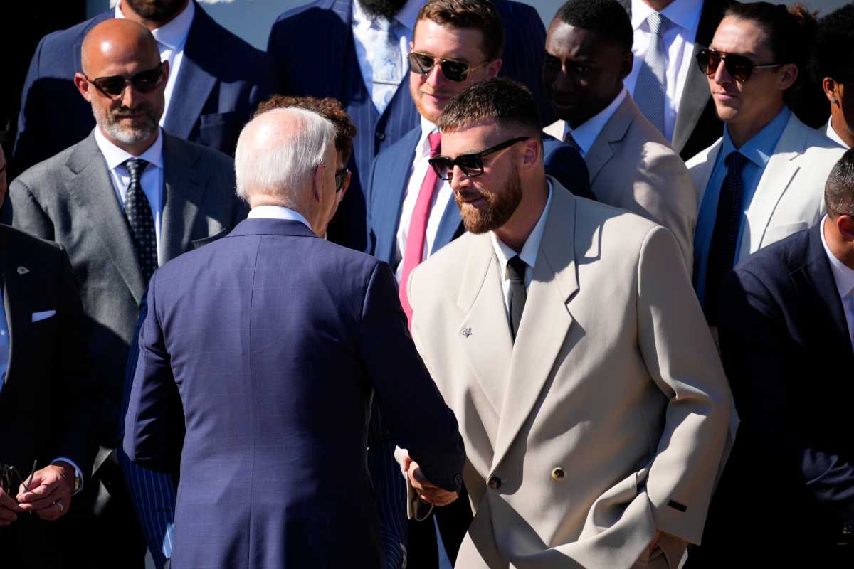 President Joe Biden shakes hands with Kansas City Chiefs tight end Travis Kelce during the team's visit to the White House on May 31, 2024.