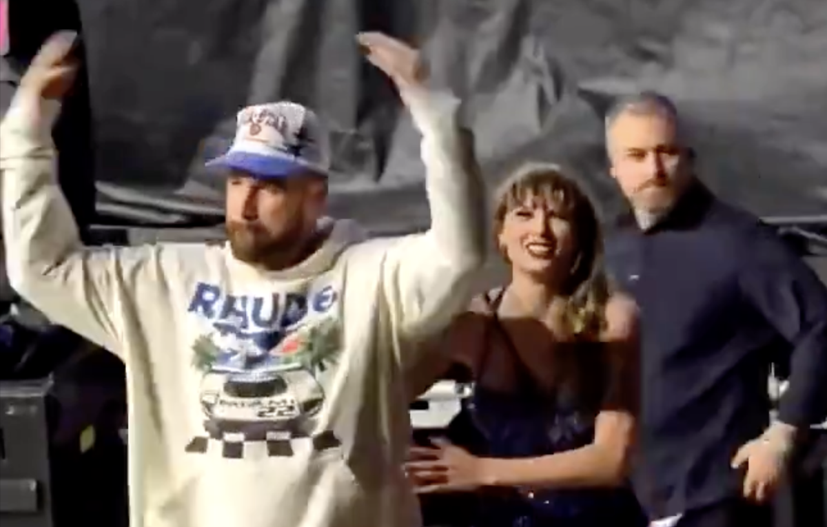 Travis Kelce encourages the crowd to cheer after Taylor Swift's second Eras Tour show in Amsterdam.