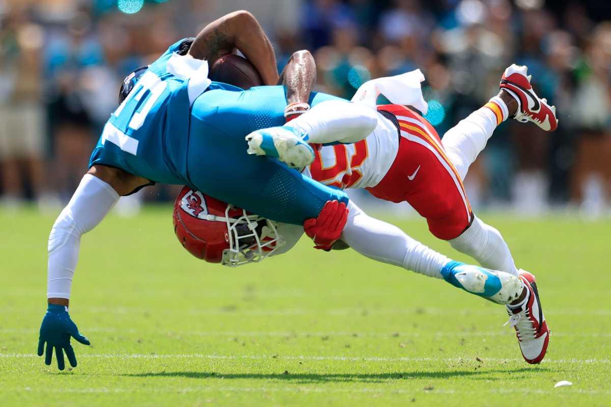 Kansas City Chiefs cornerback Jaylen Watson (35) tackles Jacksonville Jaguars wide receiver Christian Kirk (13) during the first quarter of a NFL football game Sunday, Sept. 17, 2023 at EverBank Stadium in Jacksonville, Fla. The Kansas City Chiefs defeated the Jacksonville Jaguars 17-9.  