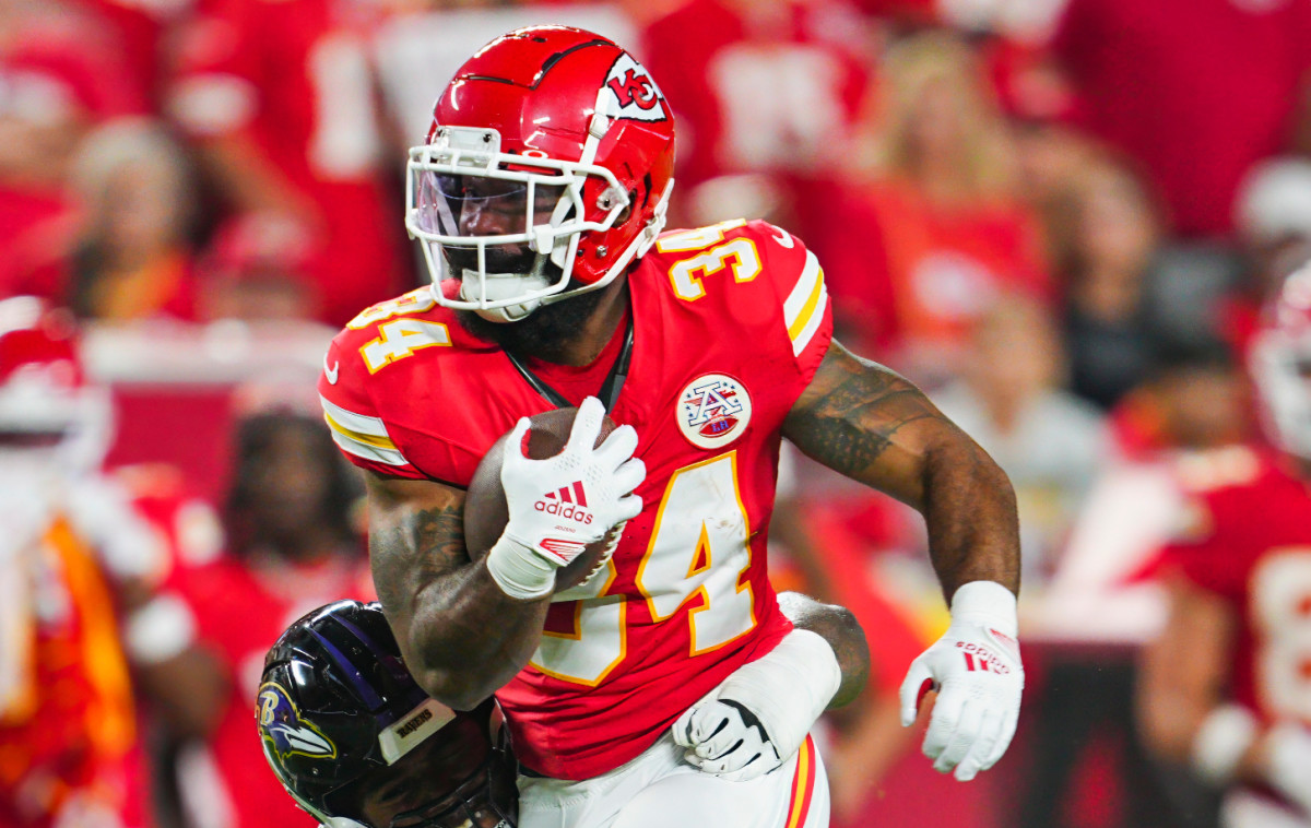 Sep 5, 2024; Kansas City, Missouri, USA; Kansas City Chiefs running back Samaje Perine (34) is tackled by Baltimore Ravens defensive tackle Travis Jones (98) at GEHA Field at Arrowhead Stadium.