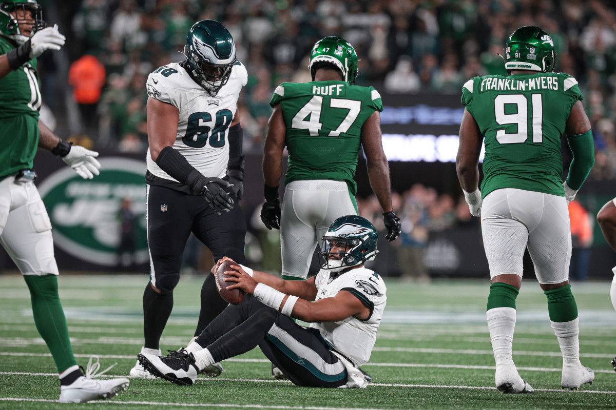 Philadelphia Eagles quarterback Jalen Hurts (1) reacts after being sacked by New York Jets linebacker Bryce Huff (47) during the second half at MetLife Stadium.