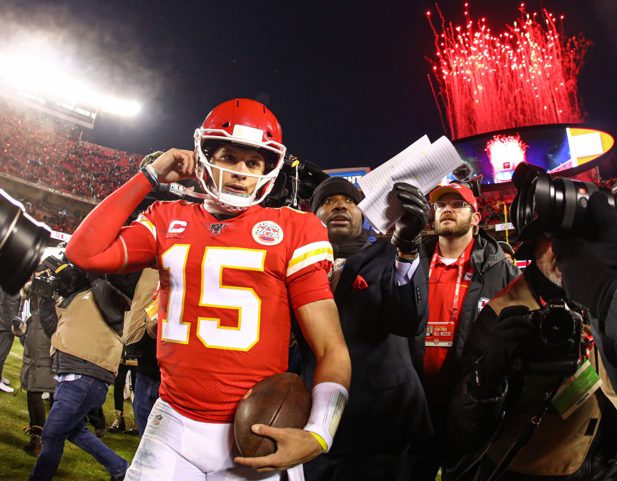 Jan 12, 2020; Kansas City, Missouri, USA; Fireworks go off as Kansas City Chiefs quarterback Patrick Mahomes (15) celebrates after defeating the Houston Texans in a AFC Divisional Round playoff football game at Arrowhead Stadium.