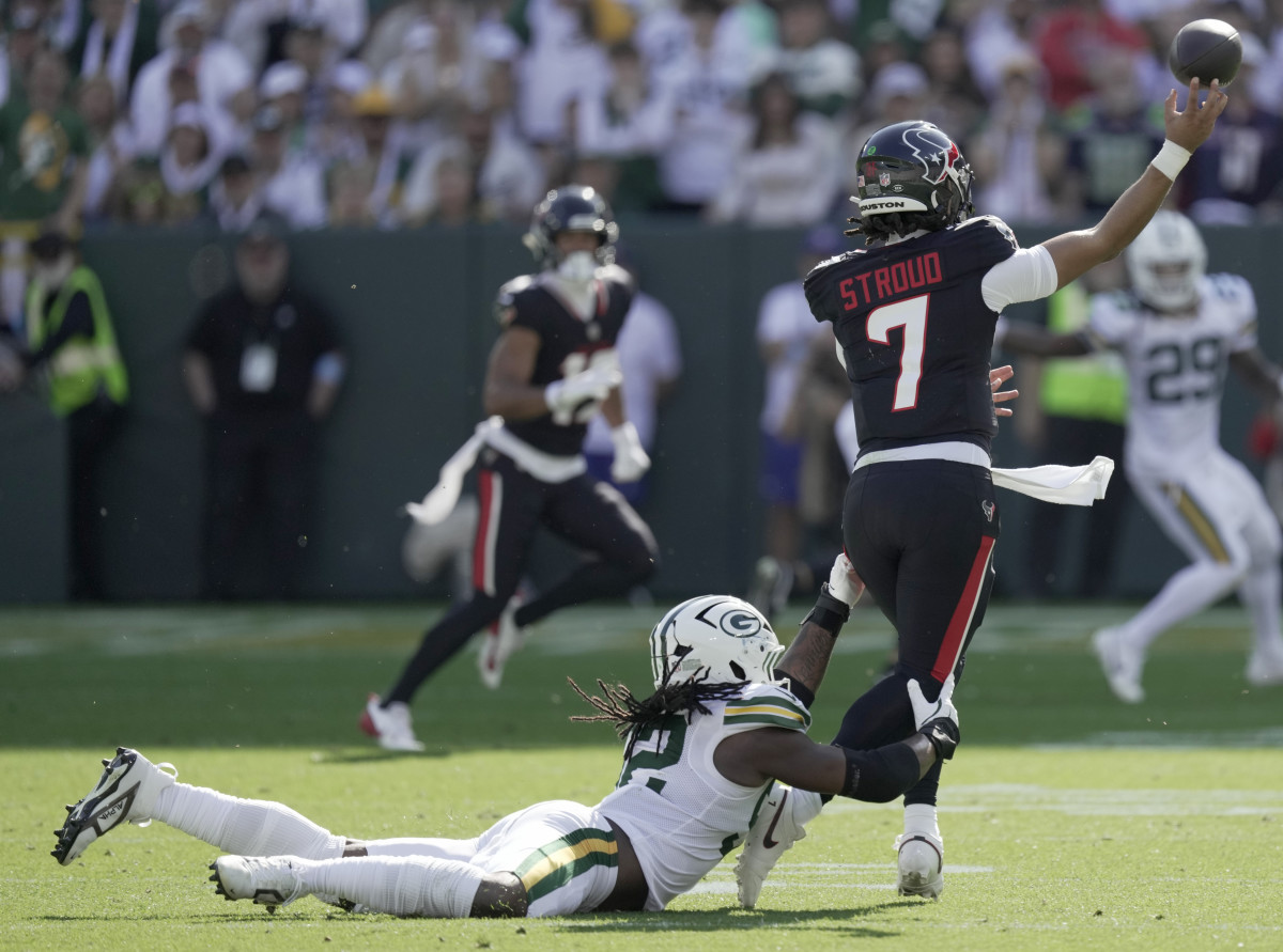 Green Bay Packers defensive end Rashan Gary (52) pressures Houston Texans quarterback C.J. Stroud (7) during the second quarter of their game at Lambeau Field.