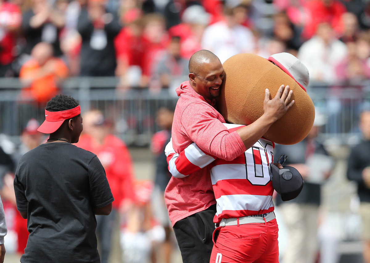 Apr 13, 2019; Columbus, OH, USA; Heisman trophy winner and Ohio State Buckeyes former player Eddie George (1) and Brutus Buckeye during the first half of the Spring Game at Ohio Stadium. Mandatory Credit: Joe Maiorana-Imagn Images  