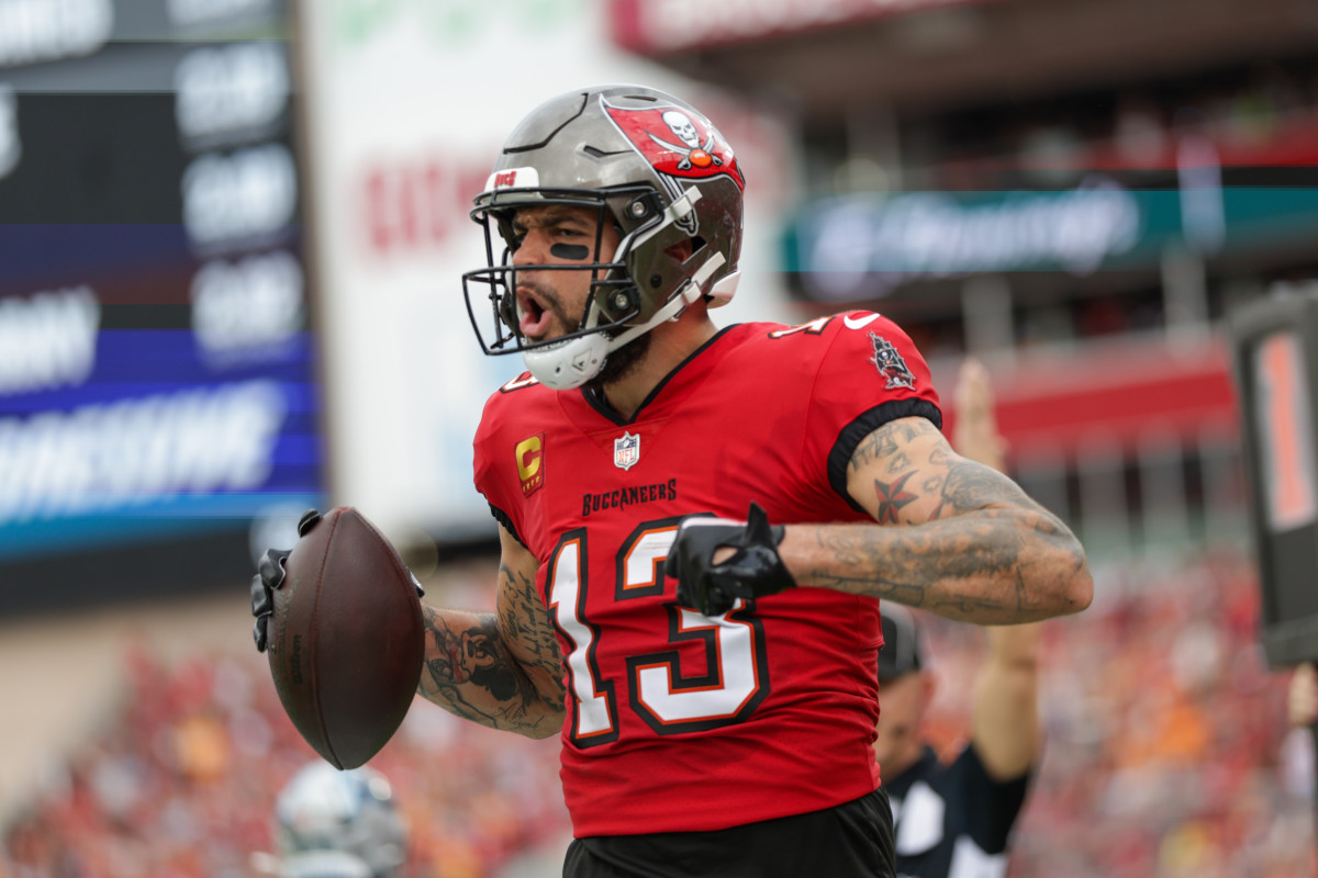 Dec 29, 2024; Tampa, Florida, USA; Tampa Bay Buccaneers wide receiver Mike Evans (13) celebrates after catching a pass for a two point conversion against the Carolina Panthers in the second quarter at Raymond James Stadium.