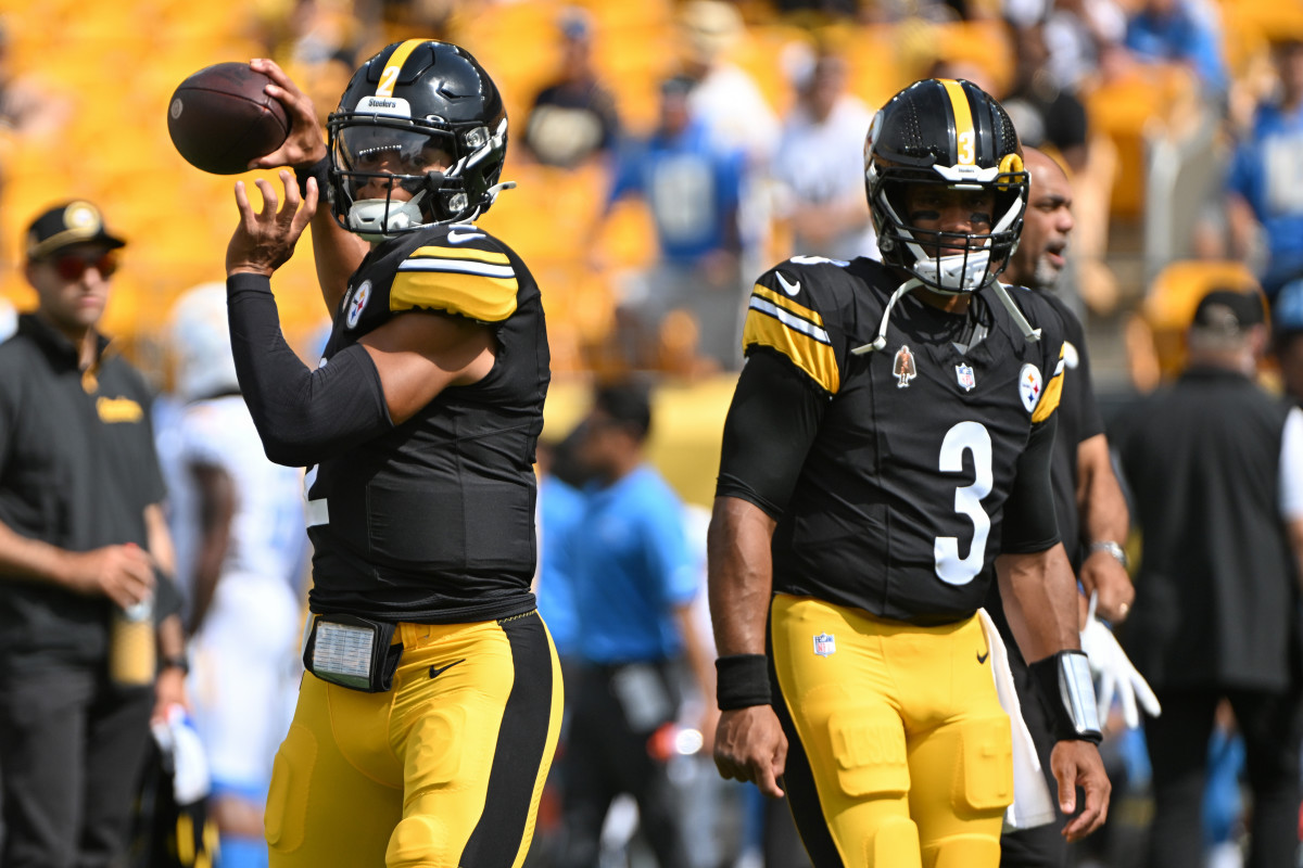 Sep 22, 2024; Pittsburgh, Pennsylvania, USA; Pittsburgh Steelers quarterback Justin Fields (2) warms up next to quarterback Russell Wilson (3) before a game against the Los Angeles Chargers at Acrisure Stadium.