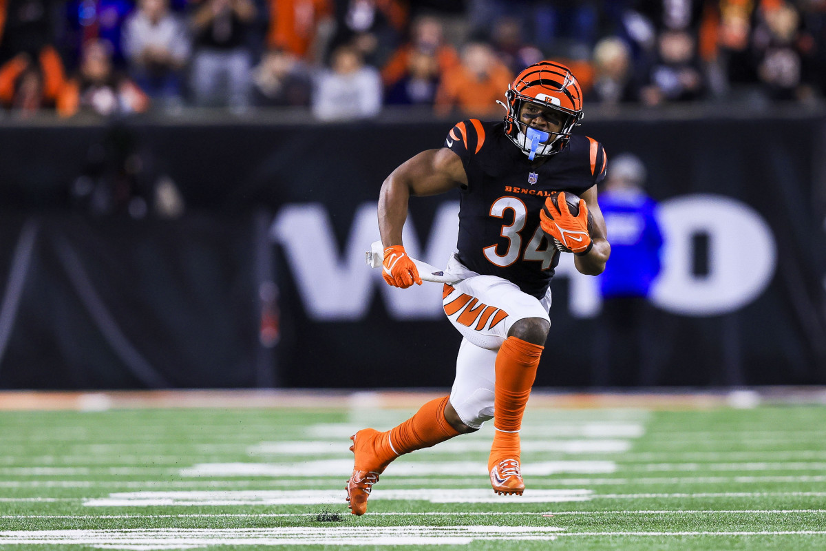 Dec 28, 2024; Cincinnati, Ohio, USA; Cincinnati Bengals running back Khalil Herbert (34) runs with the ball against the Denver Broncos in overtime at Paycor Stadium.