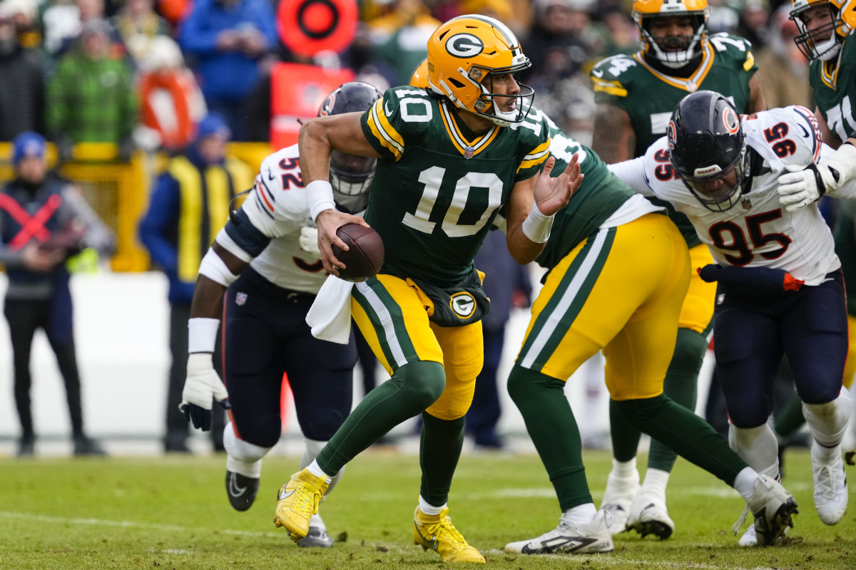 Green Bay Packers quarterback Jordan Love (10) scrambles to avoid pressure during the first quarter against the Chicago Bears at Lambeau Field. 