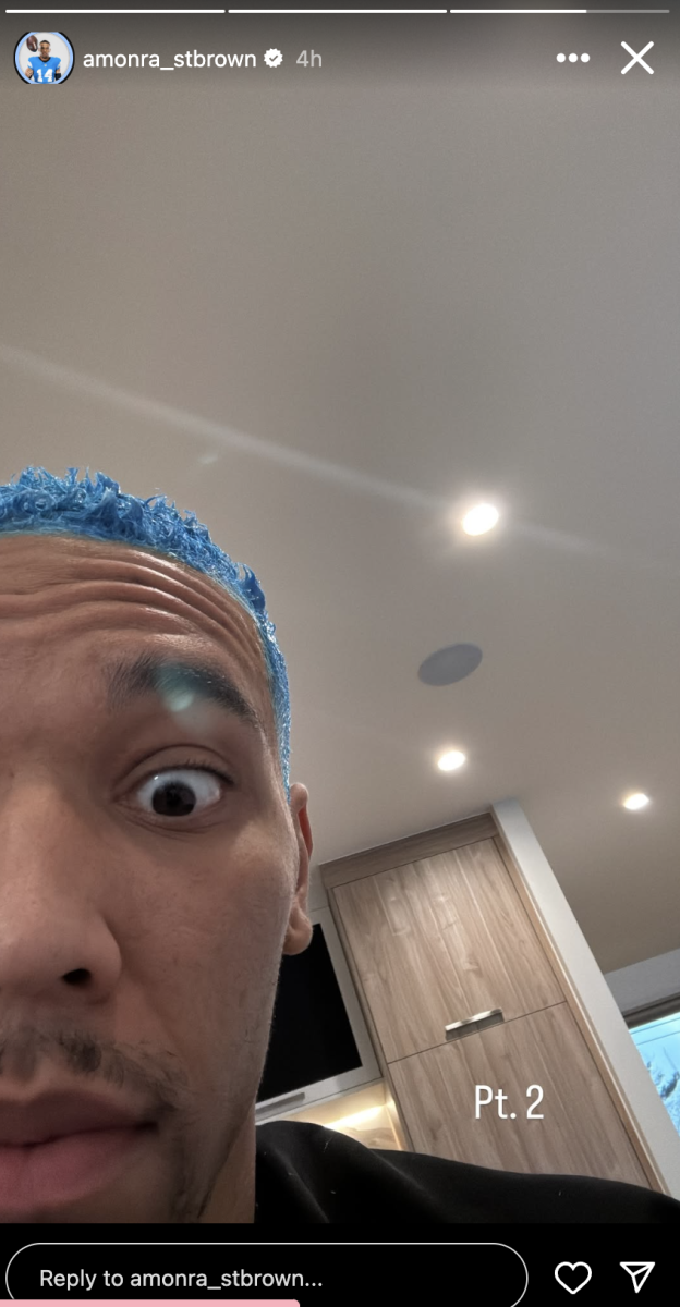 Amon-Ra St. Brown posts a photo of himself with blue hair on Instagram after the Detroit Lions clinched the No. 1 seed in the NFC