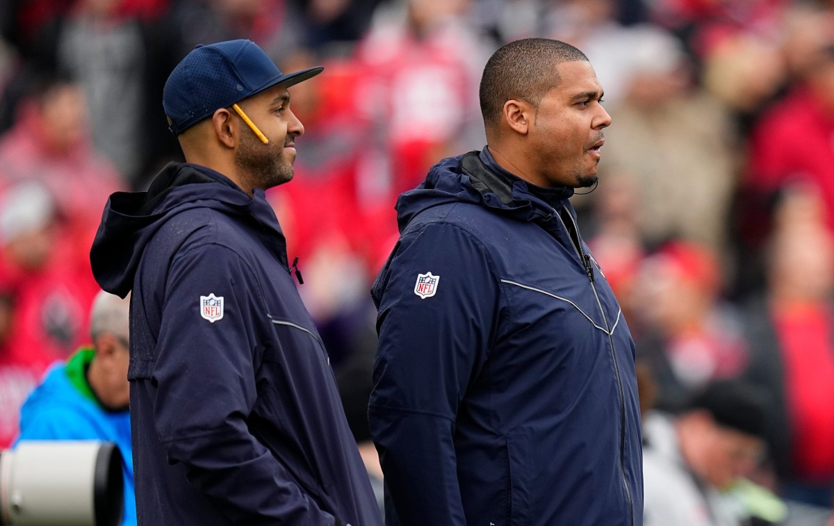 Chicago Bears general manager Ryan Poles (right) and Ian Cunningham (left) watch during the first half of the NCAA football game between the Northwestern Wildcats and the Ohio State Buckeyes at Ryan Field.