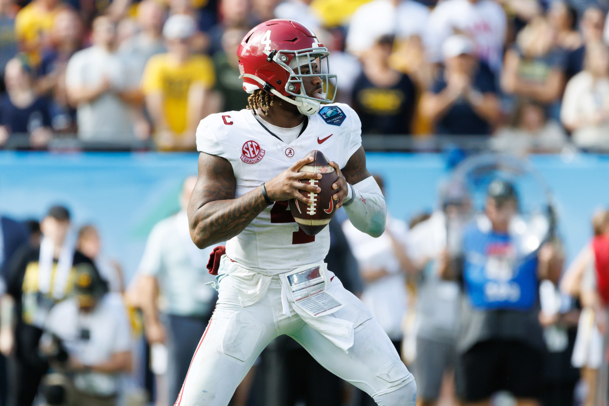 Dec 31, 2024; Tampa, FL, USA; Alabama Crimson Tide quarterback Jalen Milroe (4) looks to throw against the Michigan Wolverines during the second half at Raymond James Stadium.