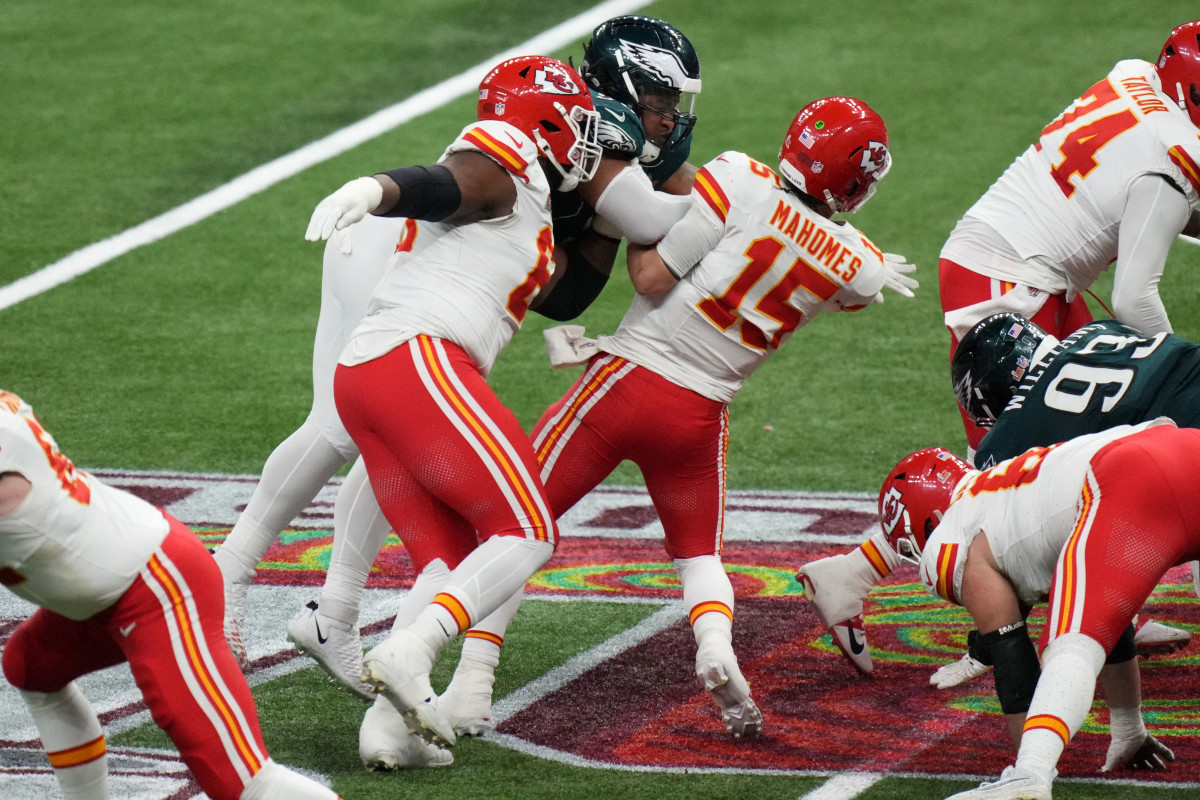 Feb 9, 2025; New Orleans, LA, USA; Kansas City Chiefs quarterback Patrick Mahomes (15) is sacked by Philadelphia Eagles defensive tackle Jalen Carter (98) and defensive tackle Milton Williams (93) during the fourth quarter in Super Bowl LIX at Caesars Superdome.