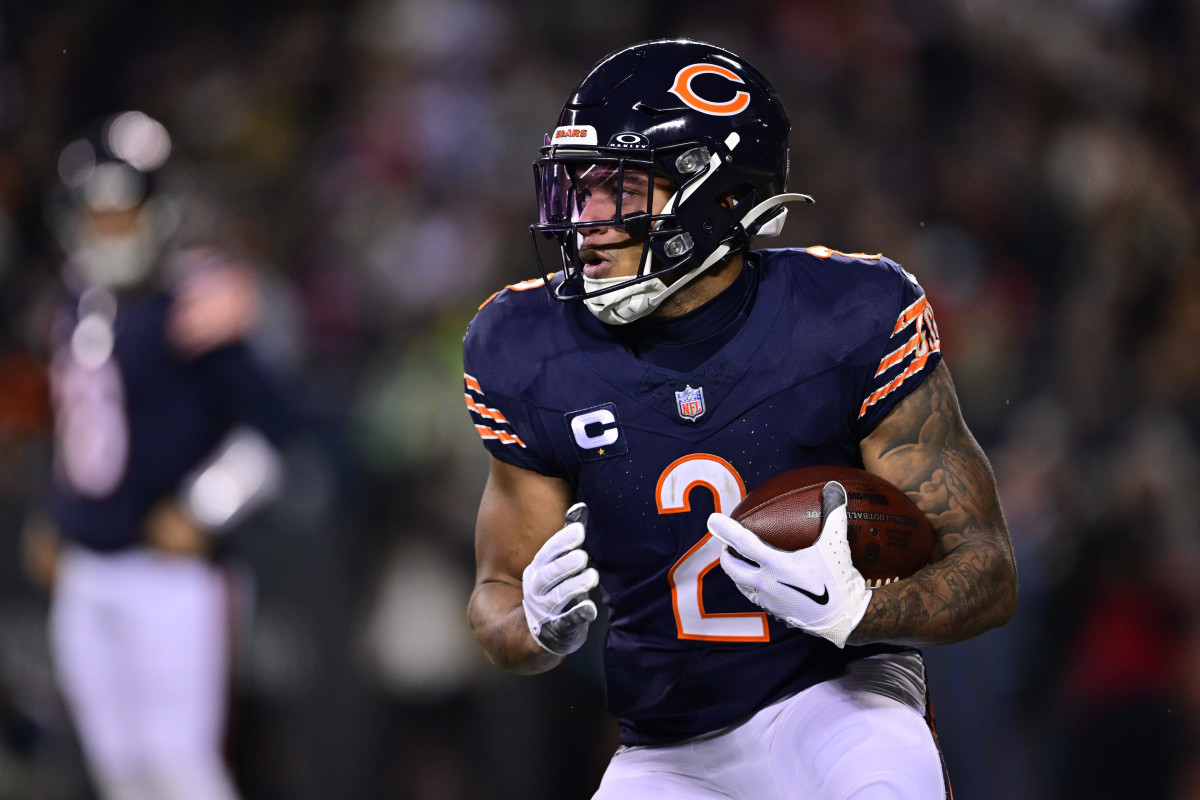 Dec 26, 2024; Chicago, Illinois, USA; Chicago Bears wide receiver DJ Moore (2) runs after a catch against the Seattle Seahawks during the second quarter at Soldier Field.