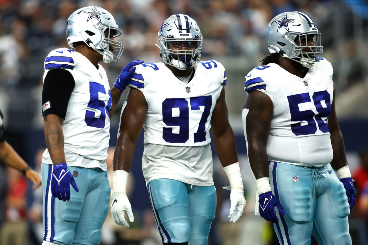 Aug 12, 2023; Arlington, Texas, USA;Dallas Cowboys defensive tackle Osa Odighizuwa (97) and defensive tackle Mazi Smith (58) on the field in the game against the Jacksonville Jaguars at AT&T Stadium.