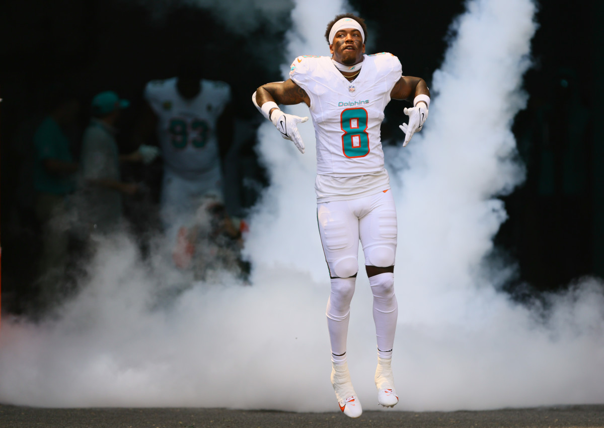 Miami Dolphins safety Jevon Holland (8) runs onto the field before the game against the Jacksonville Jaguars at Hard Rock Stadium.