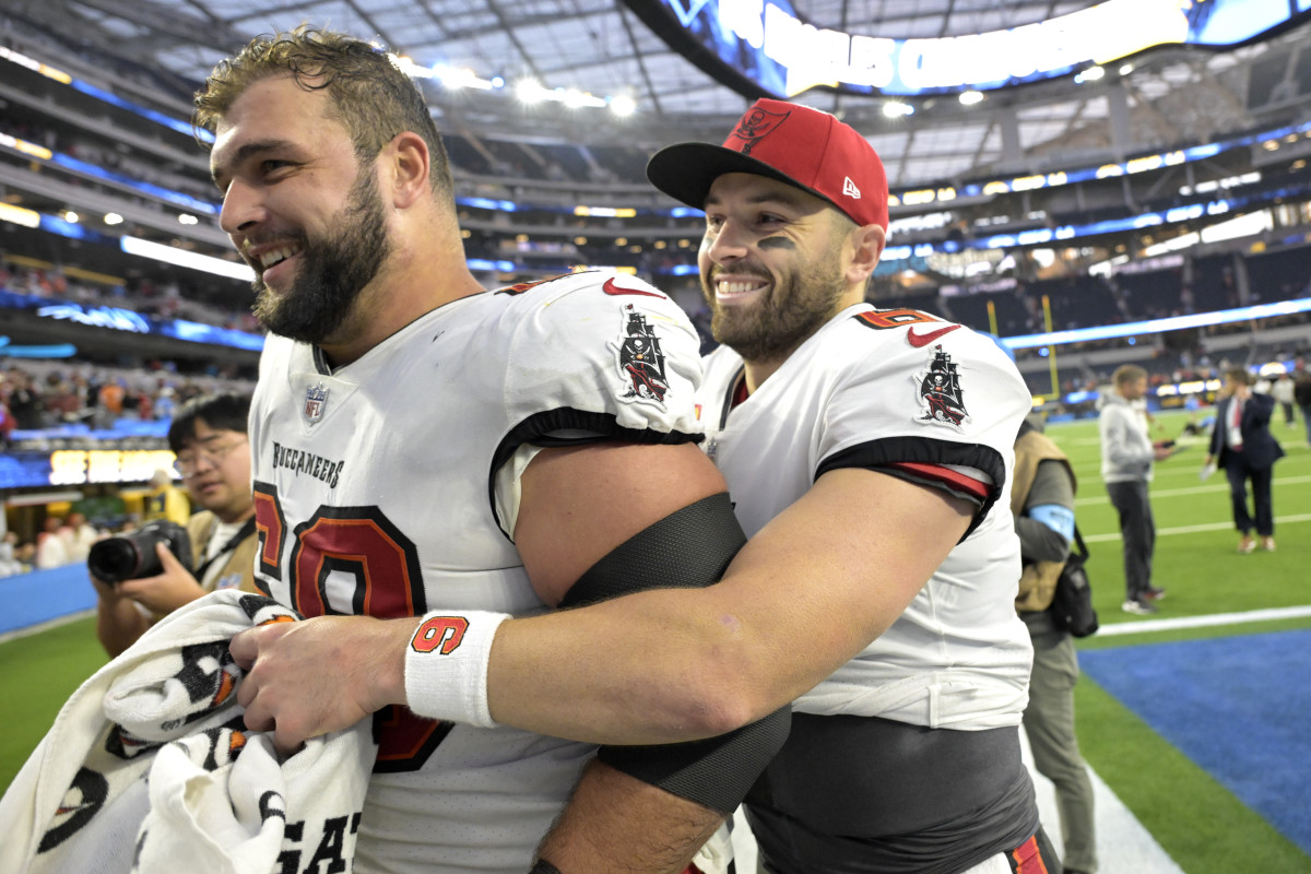 Dec 15, 2024; Inglewood, California, USA; Tampa Bay Buccaneers guard Ben Bredeson (68) and quarterback Baker Mayfield (6) celebrate as the leave the field after defeating the Los Angeles Chargers at SoFi Stadium.