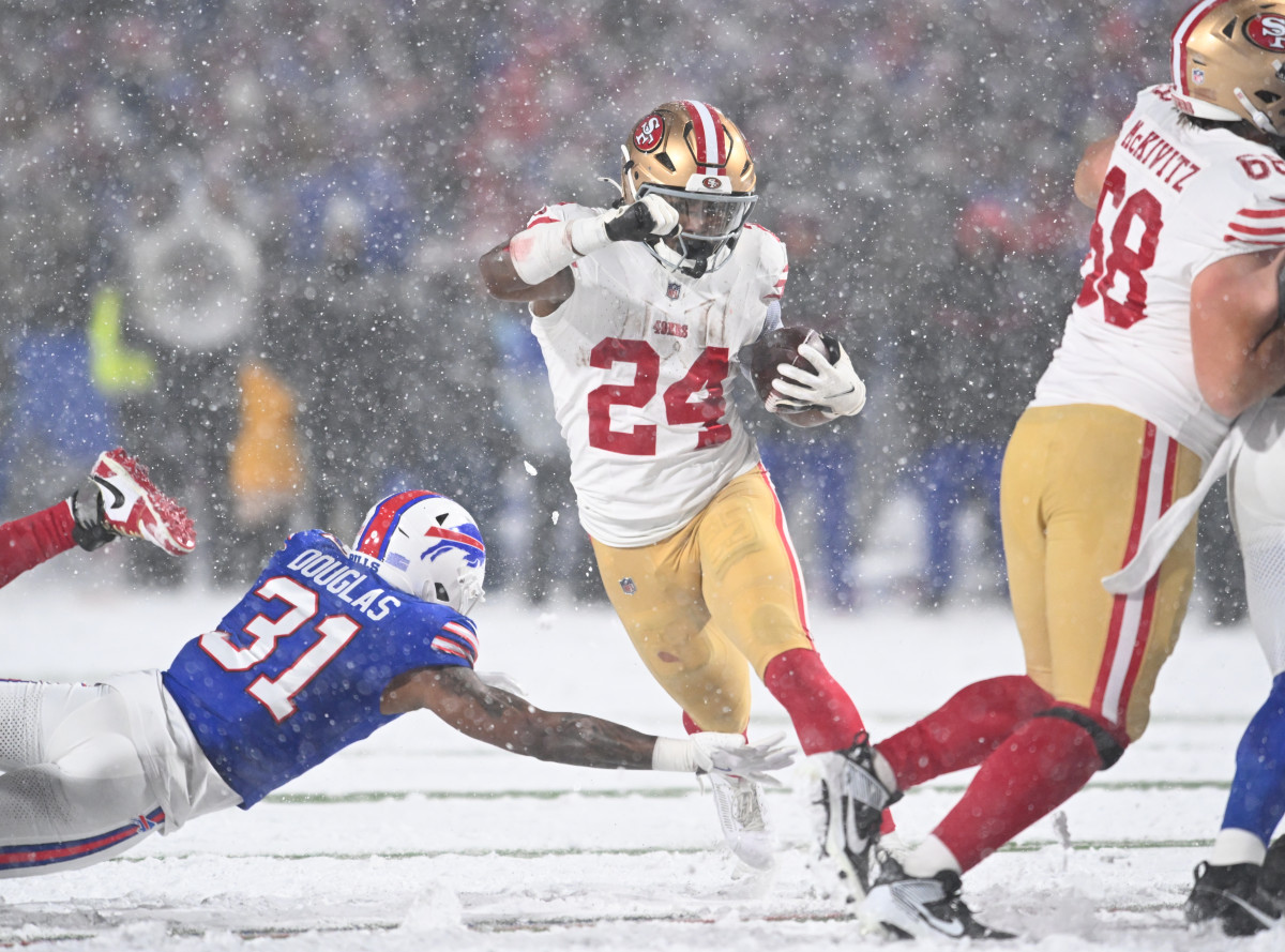 Dec 1, 2024; Orchard Park, New York, USA; San Francisco 49ers running back Jordan Mason (24) avoids a tackle by Buffalo Bills cornerback Rasul Douglas (31) in the third quarter at Highmark Stadium.