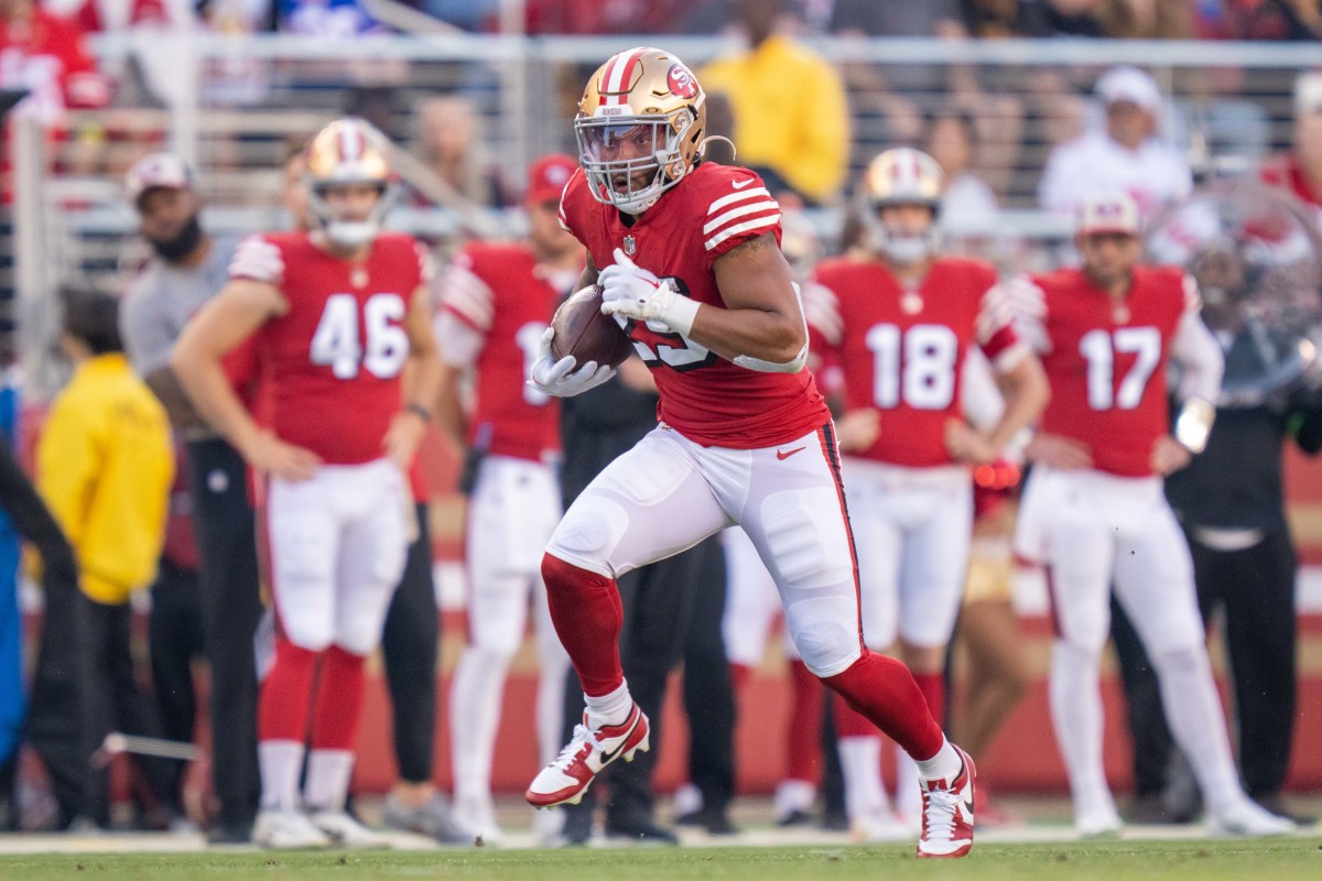 September 21, 2023; Santa Clara, California, USA; San Francisco 49ers running back Elijah Mitchell (25) runs the football against the New York Giants during the second quarter at Levi's Stadium.