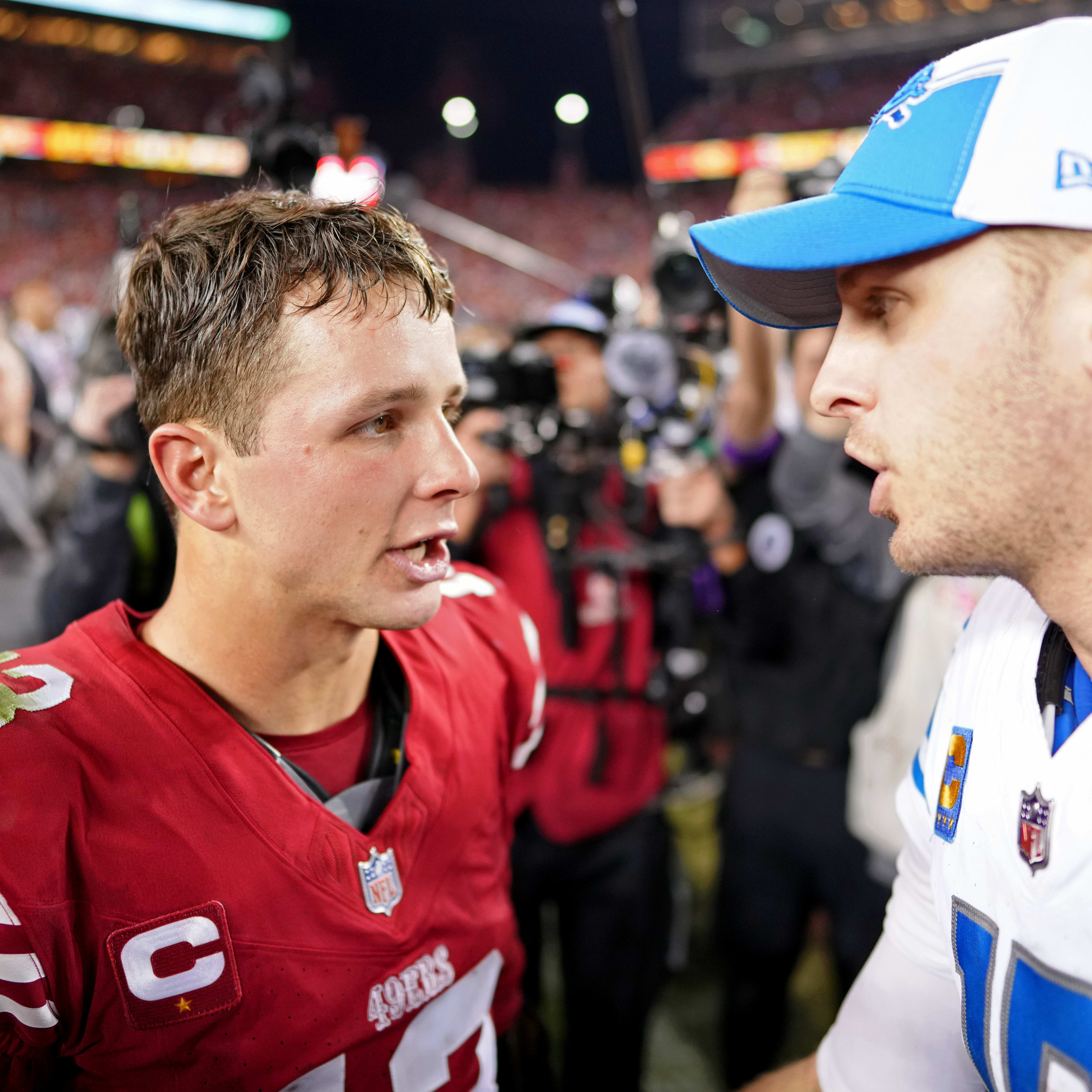 San Francisco 49ers quarterback Brock Purdy (13) talks with Detroit Lions quarterback Jared Goff (16) after the NFC Championship football game at Levi's Stadium.