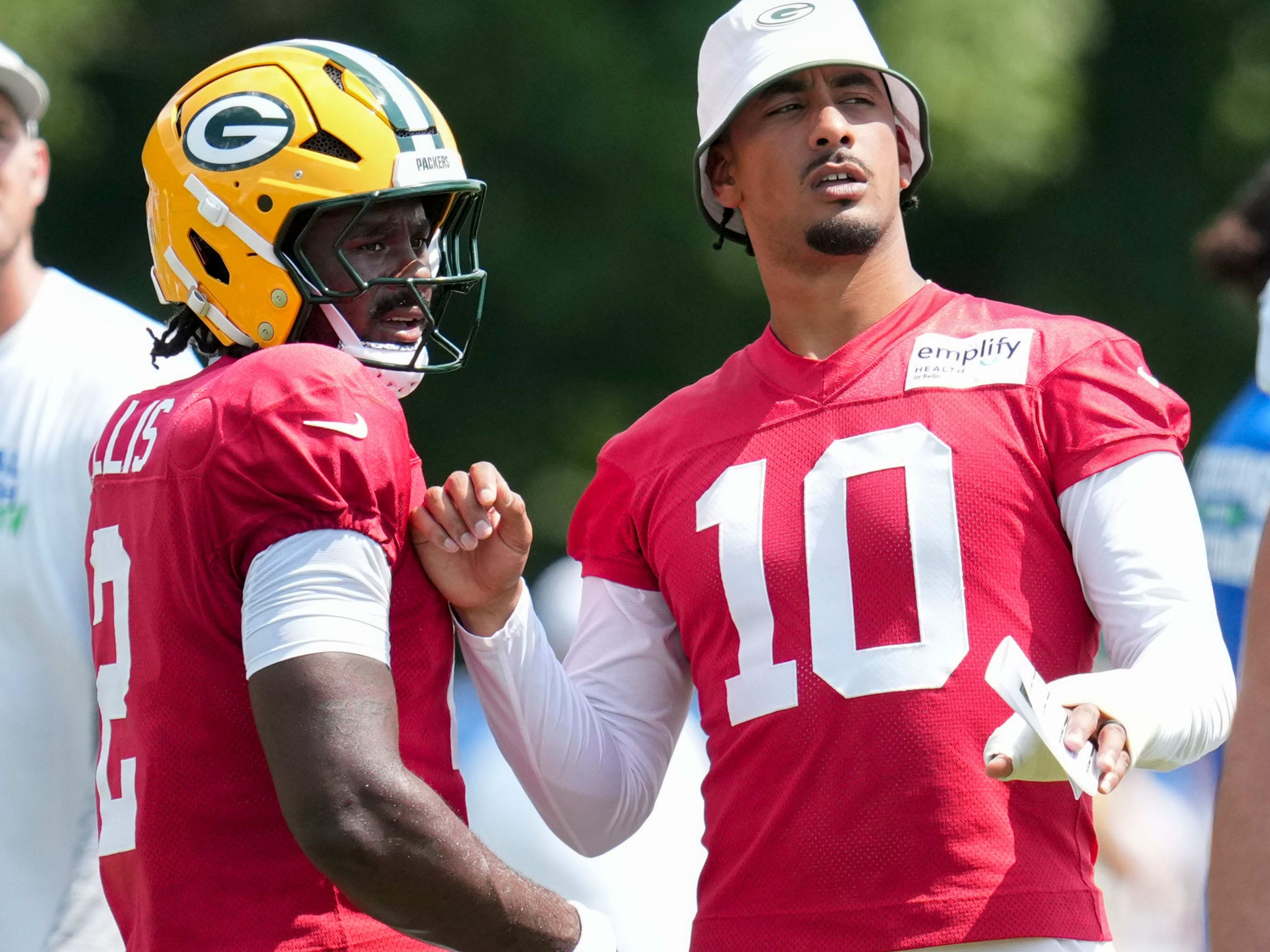 Green Bay Packers quarterback Jordan Love (10) speaks with quarterback Malik Willis (2) on Thursday, Aug. 14, 2025, at a joint practice with the Indianapolis Colts during the Colts’ training camp at Grand Park in Westfield.
