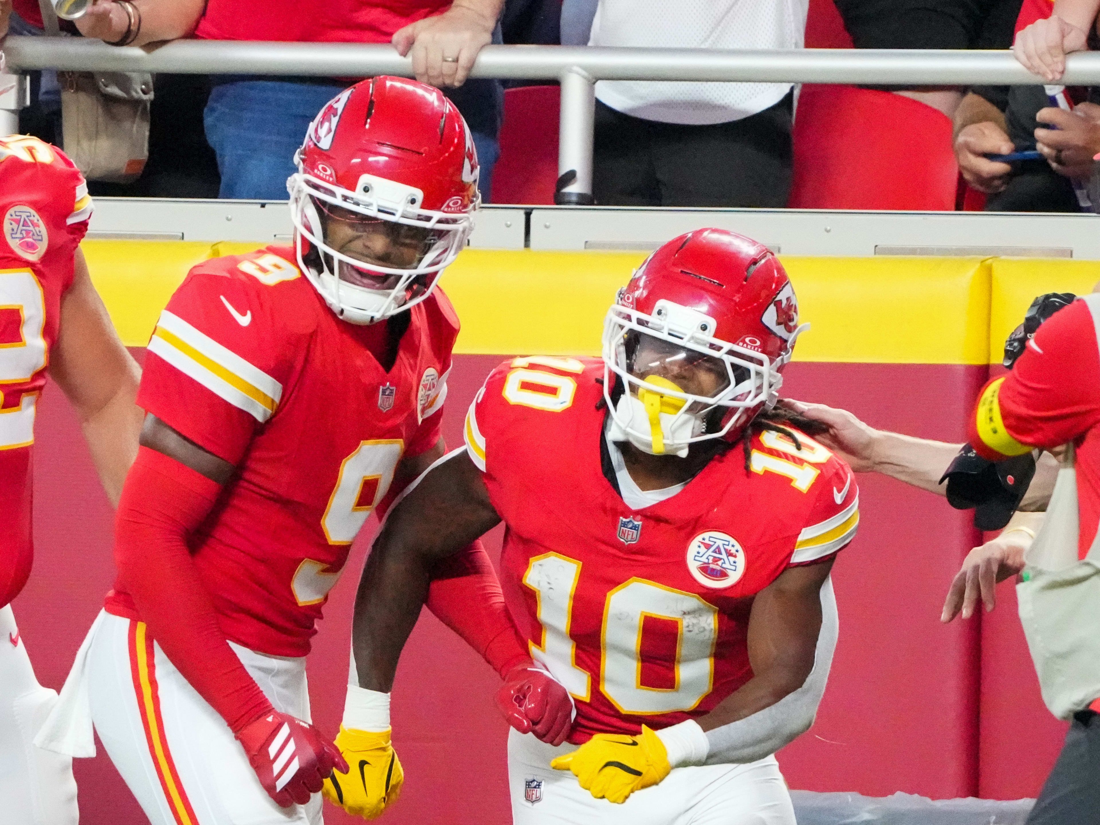 Kansas City Chiefs running back Isiah Pacheco (10) celebrates with wide receiver JuJu Smith-Schuster (9) against the Chicago Bears after a run during the first half of the game at GEHA Field at Arrowhead Stadium.