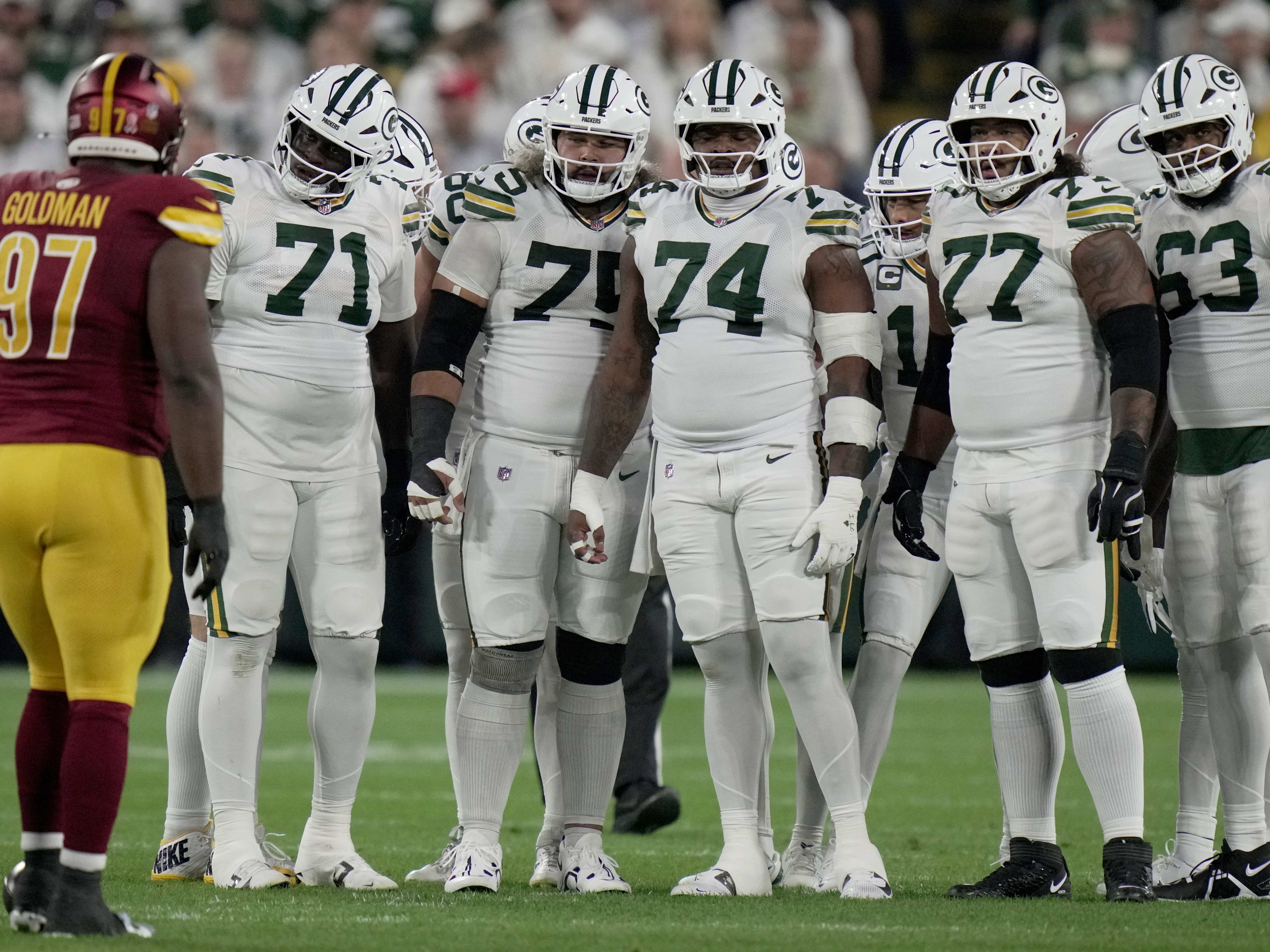 The Green Bay Packers offensive line is shown during the first quarter of their game against the Washington Commanders Thursday, September 11, 2025 at Lambeau Field in Green Bay, Wisconsin. Shown are offensive tackle Anthony Belton (71), guard Sean Rhyan (75), guard Elgton Jenkins (74), offensive tackle Jordan Morgan (77) and offensive tackle Rasheed Walker (63).
