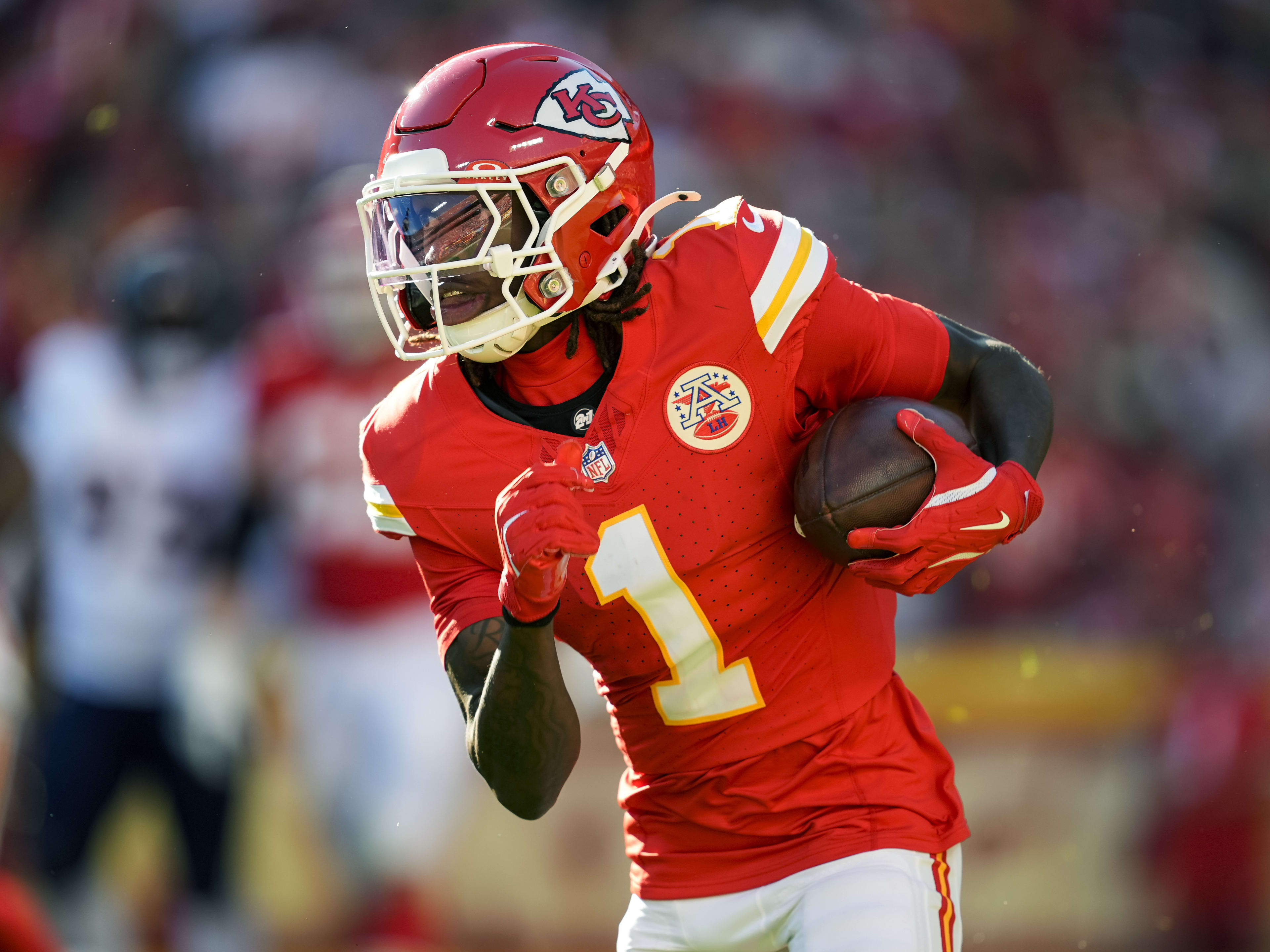 Kansas City Chiefs wide receiver Xavier Worthy (1) returns to the sidelines after a play against the Baltimore Ravens during the second half at GEHA Field at Arrowhead Stadium.