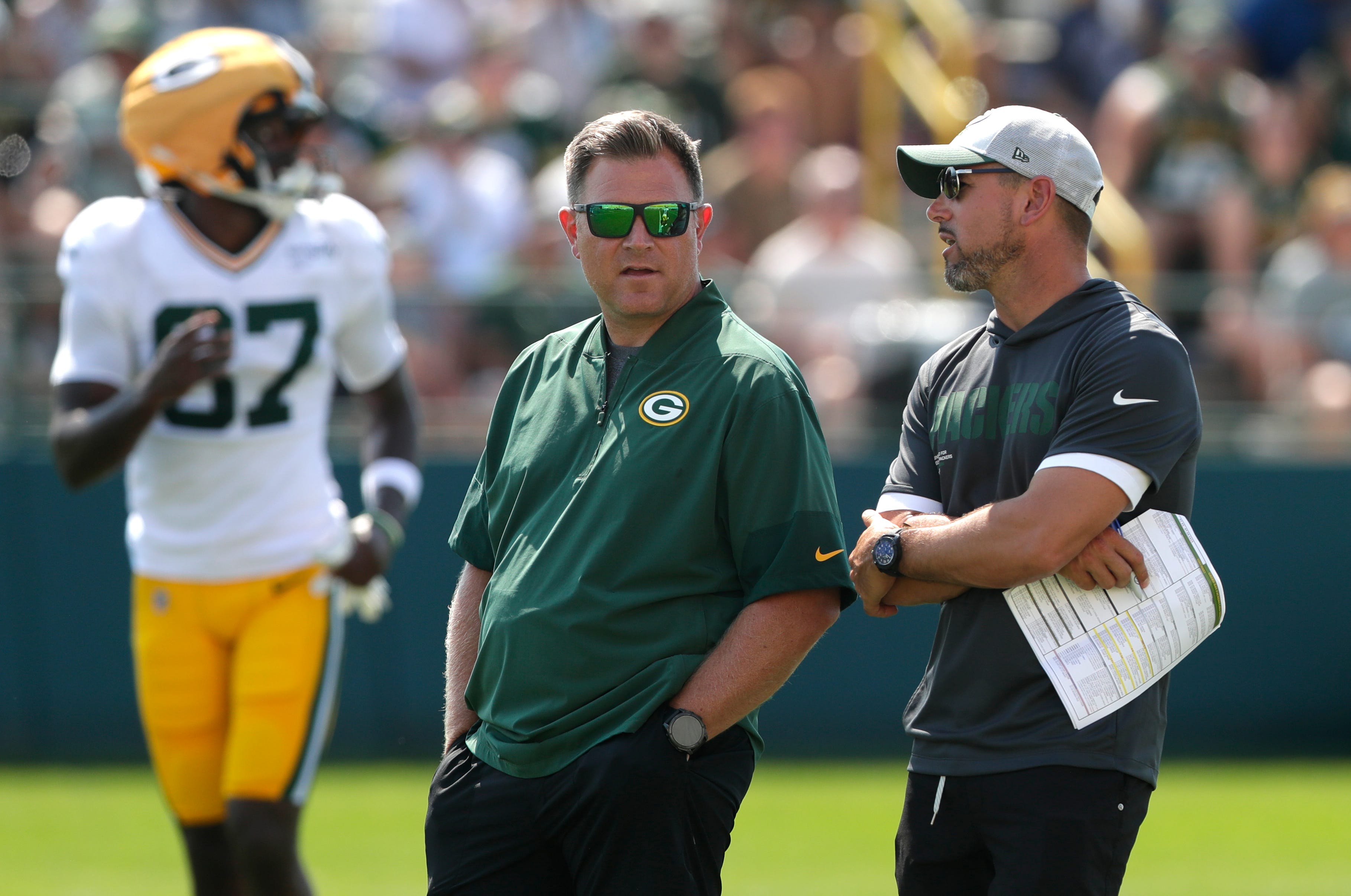 Green Bay Packers General Manager Brian Gutekunst talks with head coach Matt LaFleur during fifth day of training camp on July 28, 2025, at Ray Nitschke Field in Ashwaubenon, Wis.
