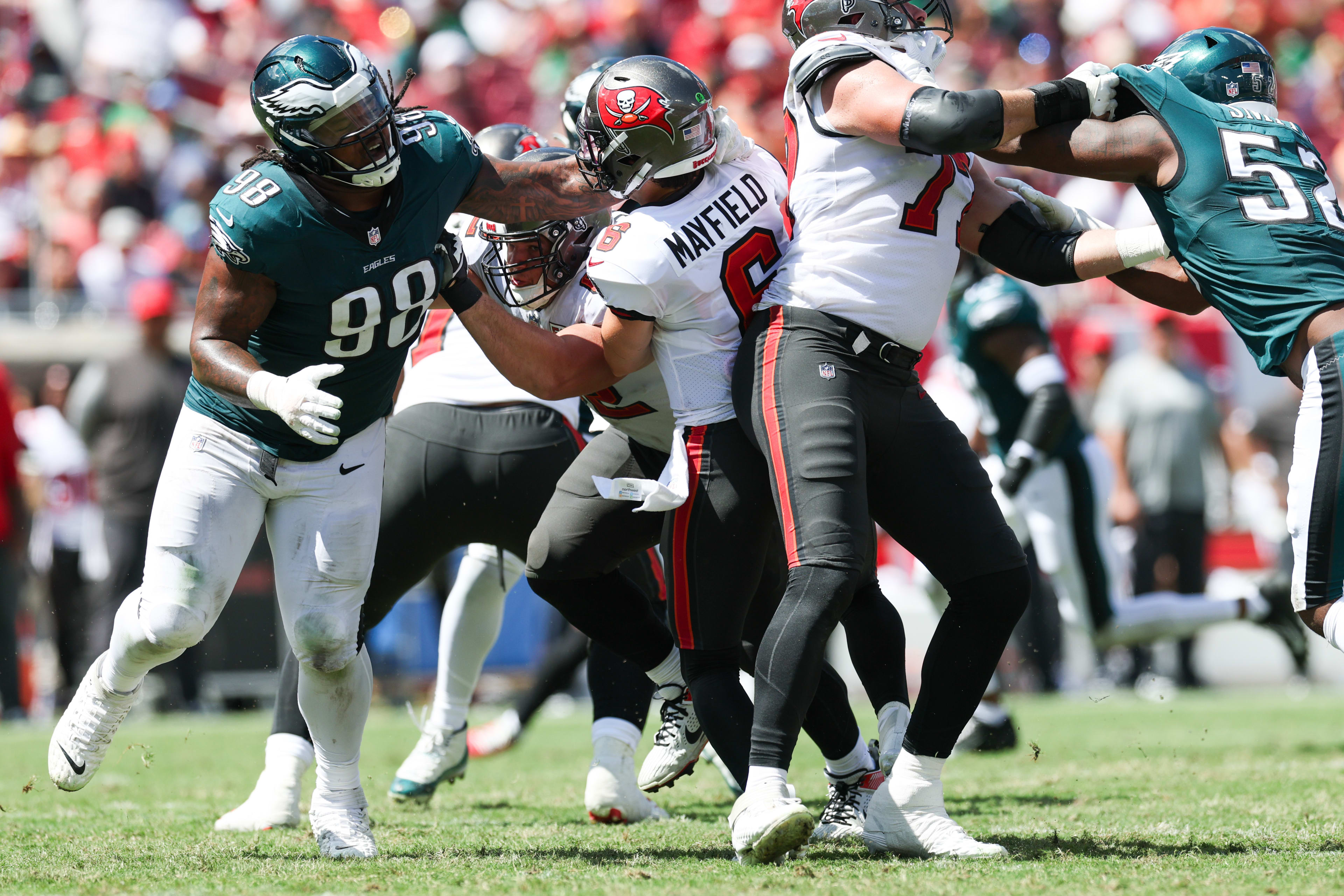 Sep 28, 2025; Tampa, Florida, USA; Philadelphia Eagles defensive tackle Jalen Carter (98) roughs the passer Tampa Bay Buccaneers quarterback Baker Mayfield (6) during the second quarter at Raymond James Stadium.
