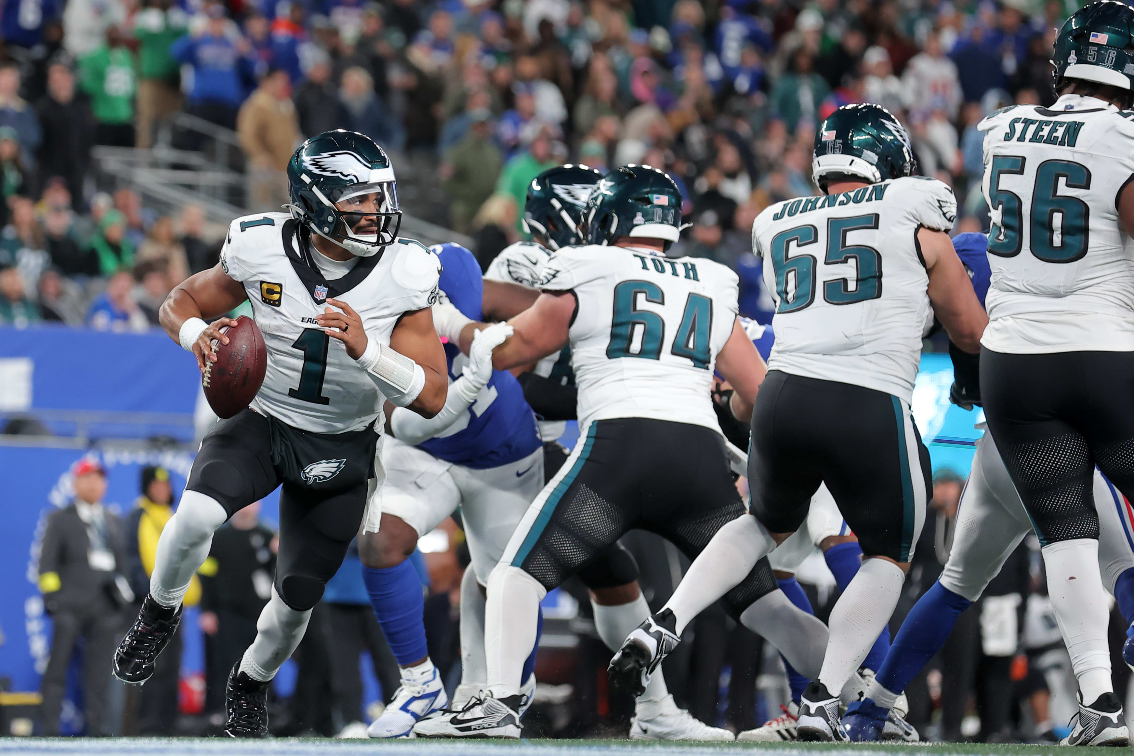 Oct 9, 2025; East Rutherford, New Jersey, USA; Philadelphia Eagles quarterback Jalen Hurts (1) looks to pass against the New York Giants during the fourth quarter of the game at MetLife Stadium.