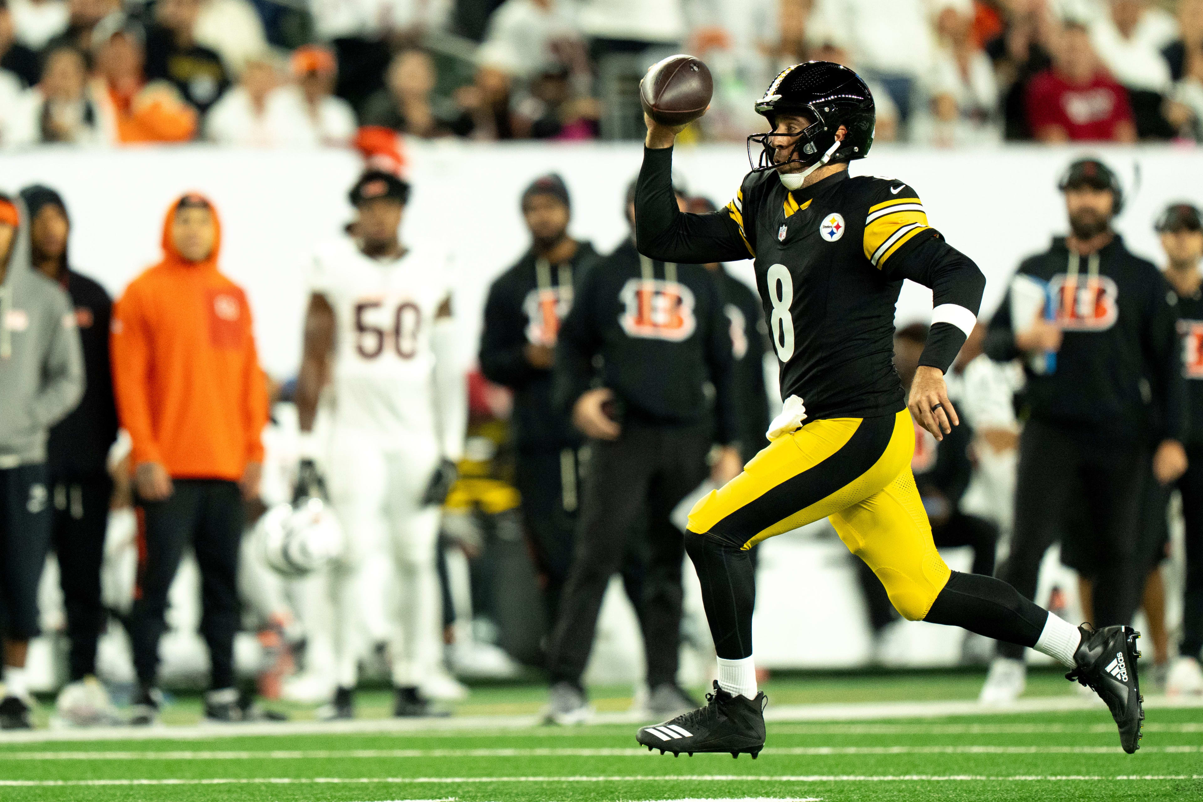 Pittsburgh Steelers quarterback Aaron Rodgers (8) runs downfield in the second quarter of the NFL game between the Cincinnati Bengals and Pittsburgh Steelers at Paycor Stadium in Cincinnati on Oct. 16, 2025.