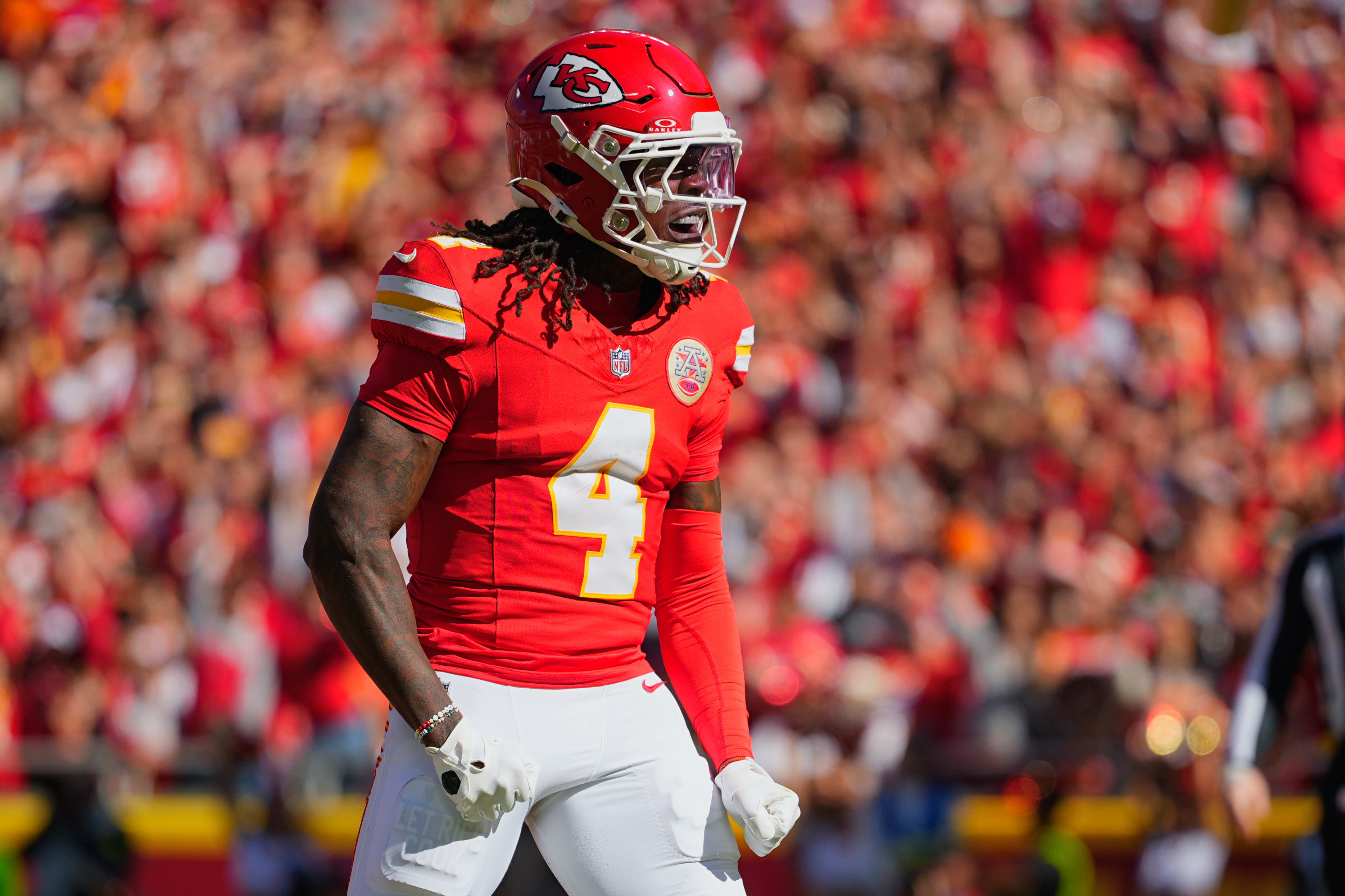 Oct 19, 2025; Kansas City, Missouri, USA; Kansas City Chiefs wide receiver Rashee Rice (4) celebrates after scoring a touchdown against the Las Vegas Raiders during the first quarter of the game at GEHA Field at Arrowhead Stadium.