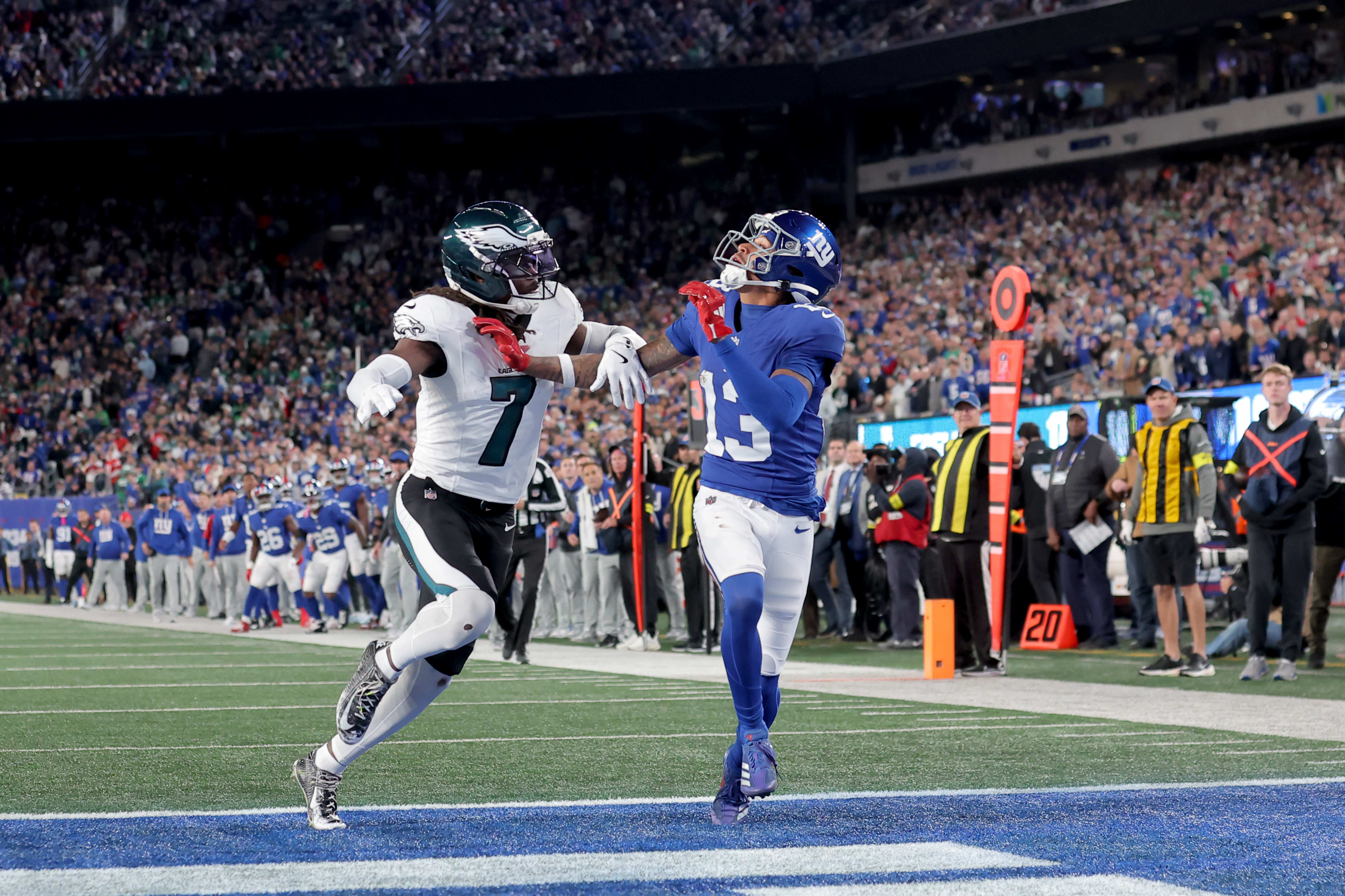 Philadelphia Eagles cornerback Kelee Ringo (7) commits pass interference against New York Giants wide receiver Jalin Hyatt (13) on a pass play during the fourth quarter at MetLife Stadium.