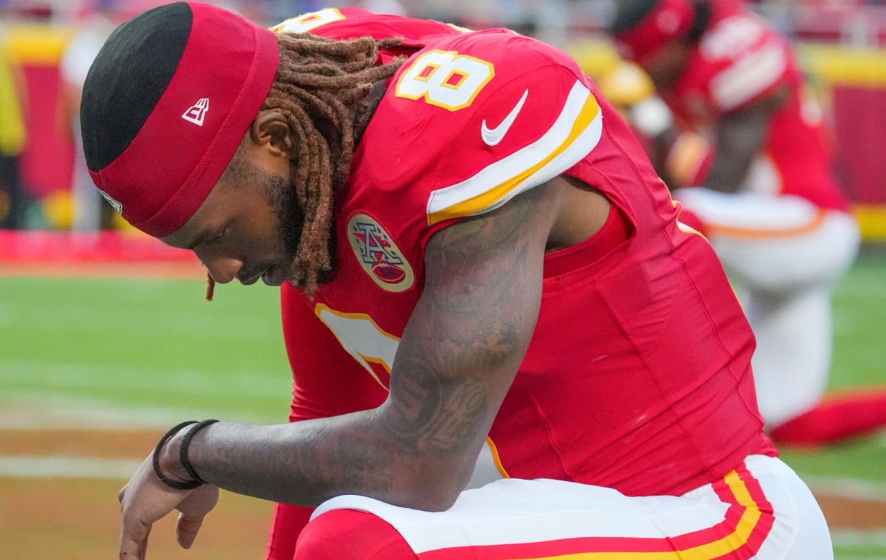 Aug 22, 2025; Kansas City, Missouri, USA; Kansas City Chiefs cornerback Kristian Fulton (8) kneels on field prior to a game at GEHA Field at Arrowhead Stadium.