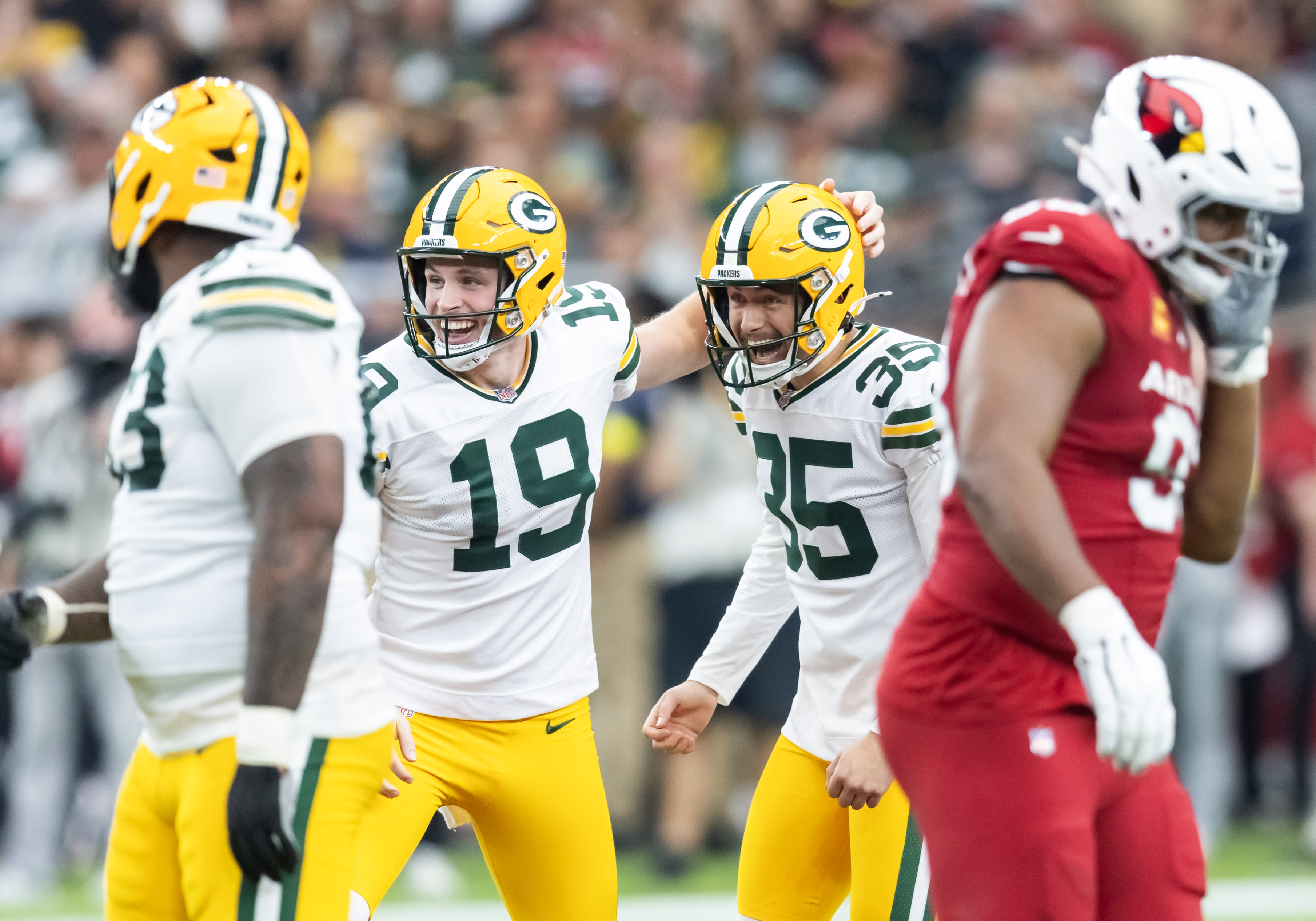 Oct 19, 2025; Glendale, Arizona, USA; Green Bay Packers kicker Lucas Havrisik (35) celebrates a field goal with punter Daniel Whelan (19) against the Arizona Cardinals in the first half at State Farm Stadium.