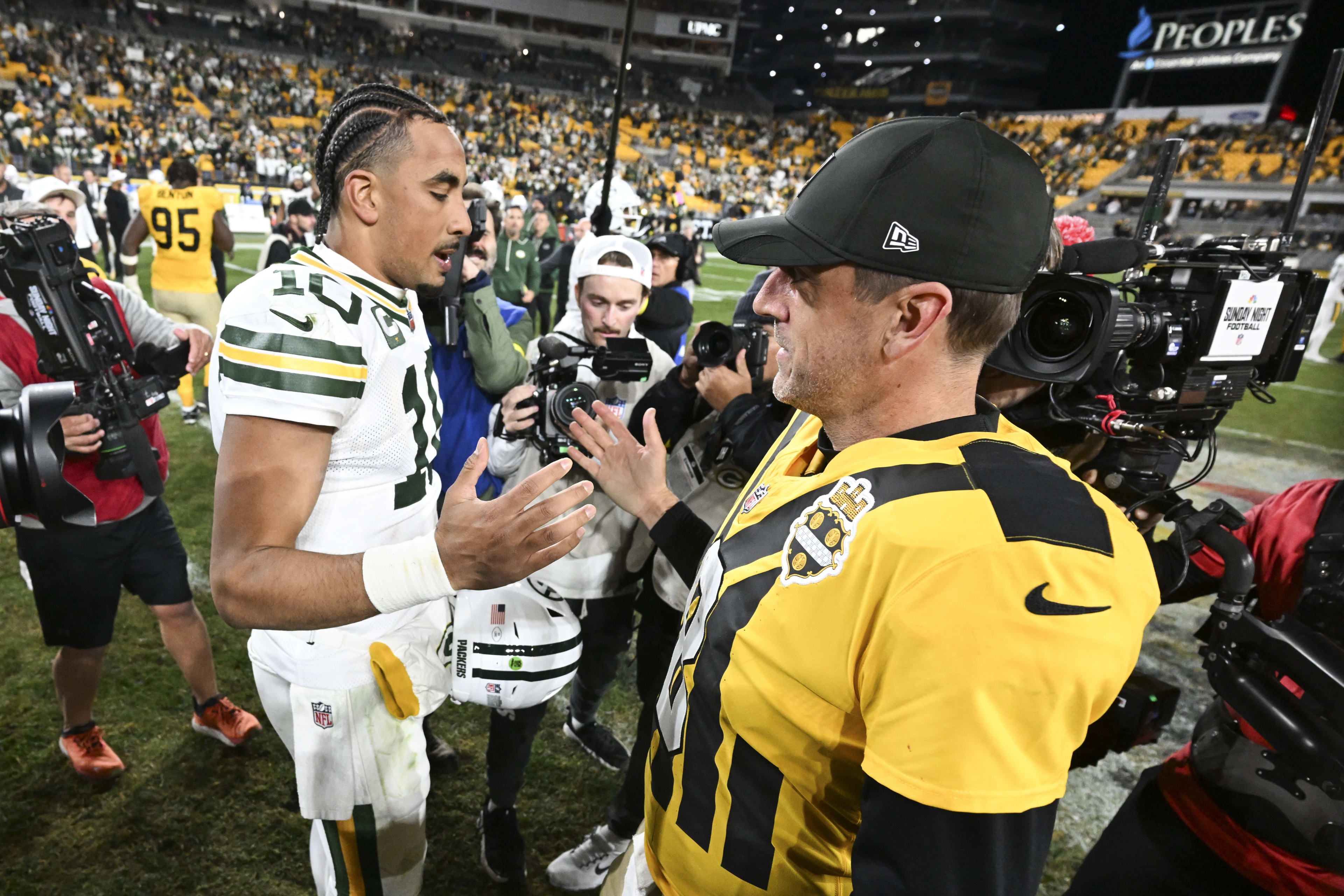 Oct 26, 2025; Pittsburgh, Pennsylvania, USA; Pittsburgh Steelers quarterback Aaron Rodgers (8) and Green Bay Packers quarterback Jordan Love (10) shake hands after the game at Acrisure Stadium.