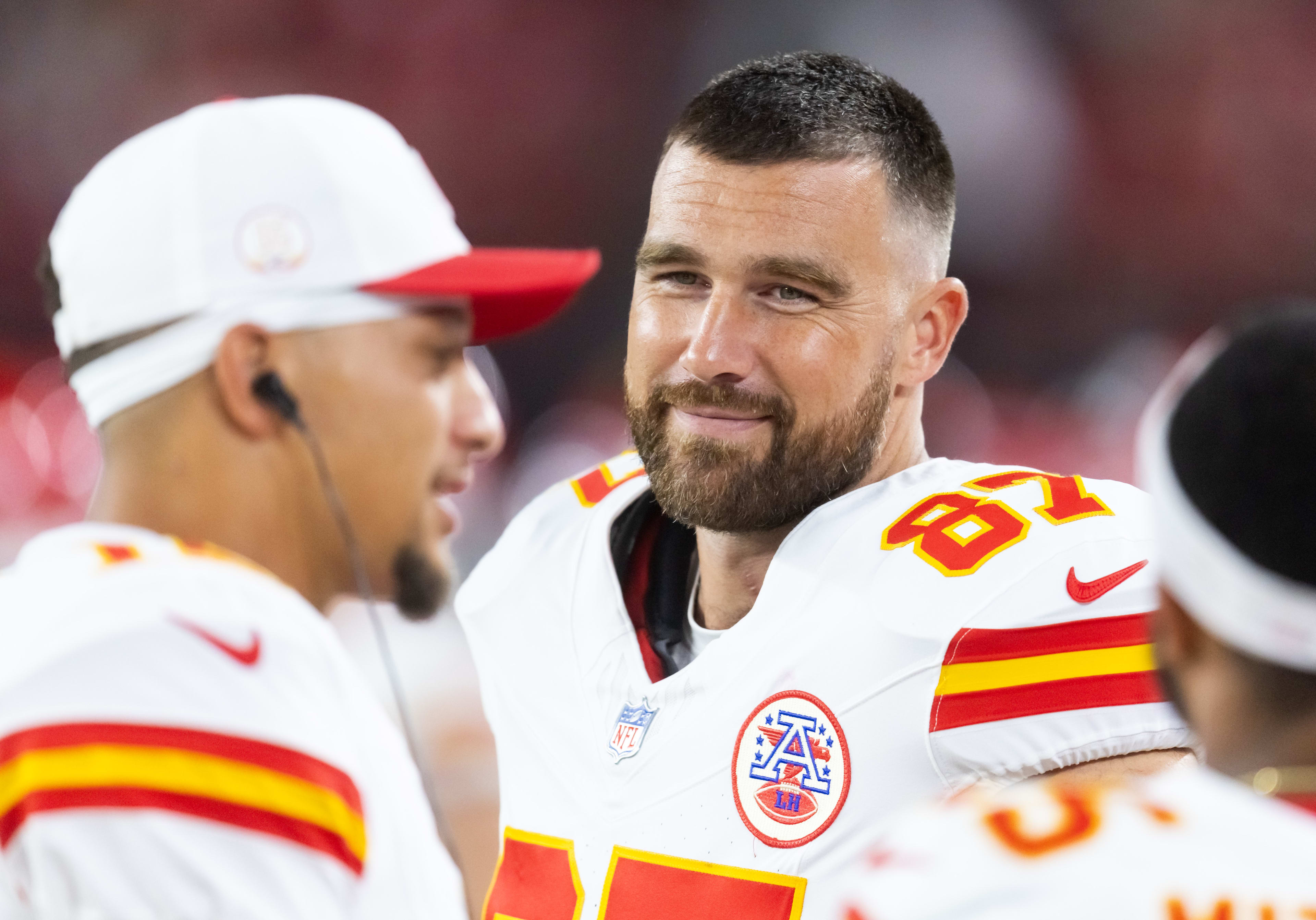 Aug 9, 2025; Glendale, Arizona, USA; Kansas City Chiefs tight end Travis Kelce (87) with quarterback Patrick Mahomes (15) against the Arizona Cardinals during a preseason NFL game at State Farm Stadium. Mandatory Credit: Mark J. Rebilas-Imagn Images