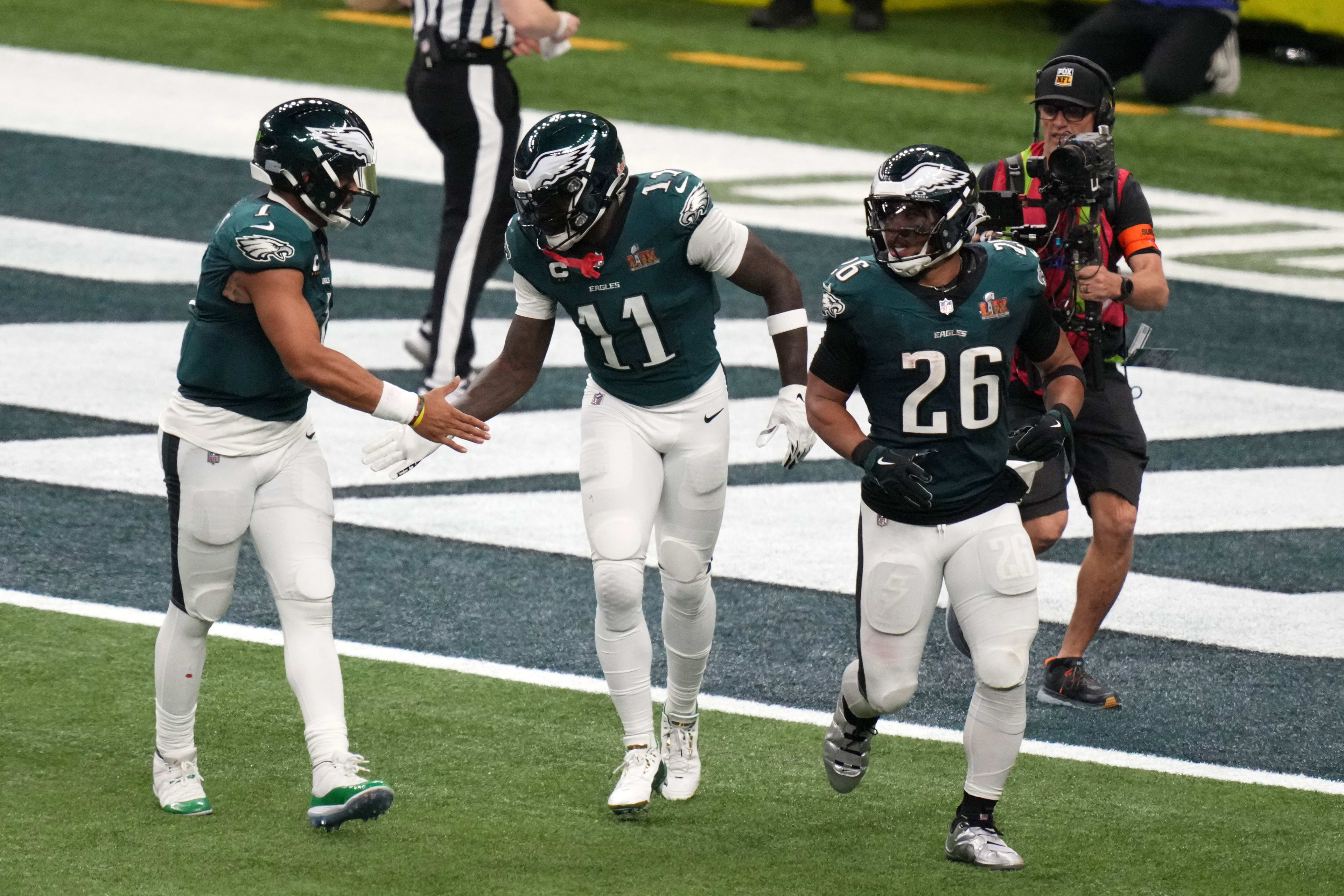 Philadelphia Eagles wide receiver A.J. Brown (11) reacts with quarterback Jalen Hurts (1) after making a touchdown catch against the Kansas City Chiefs during the second quarter in Super Bowl LIX.