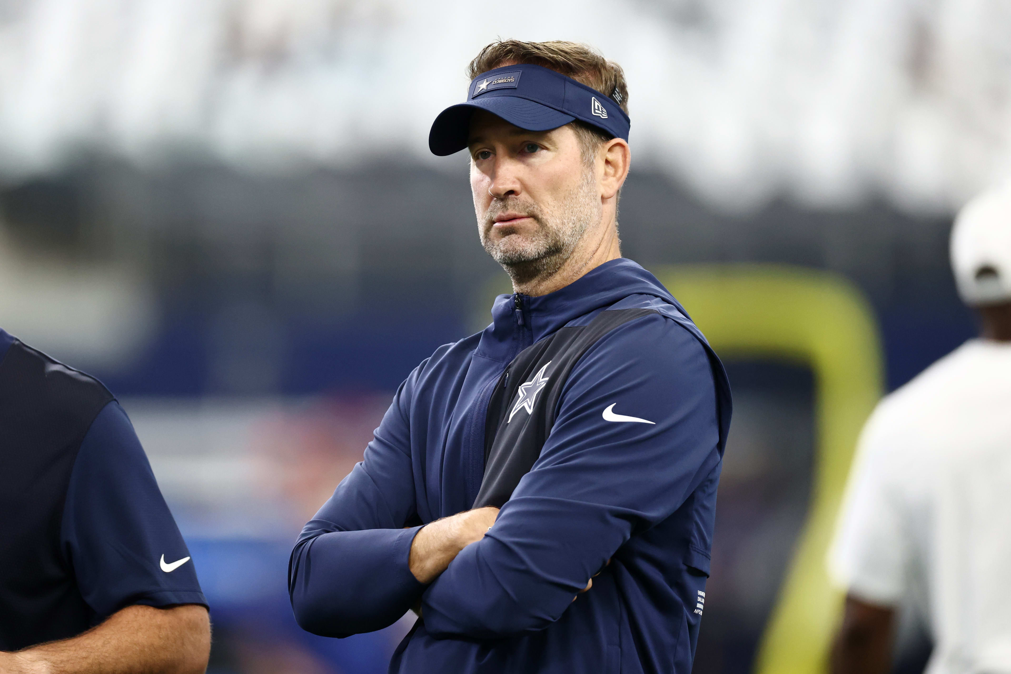 Sep 14, 2025; Arlington, Texas, USA; Dallas Cowboys head coach Brian Schottenheimer looks on during warmups before the game New York Giants at AT&T Stadium.