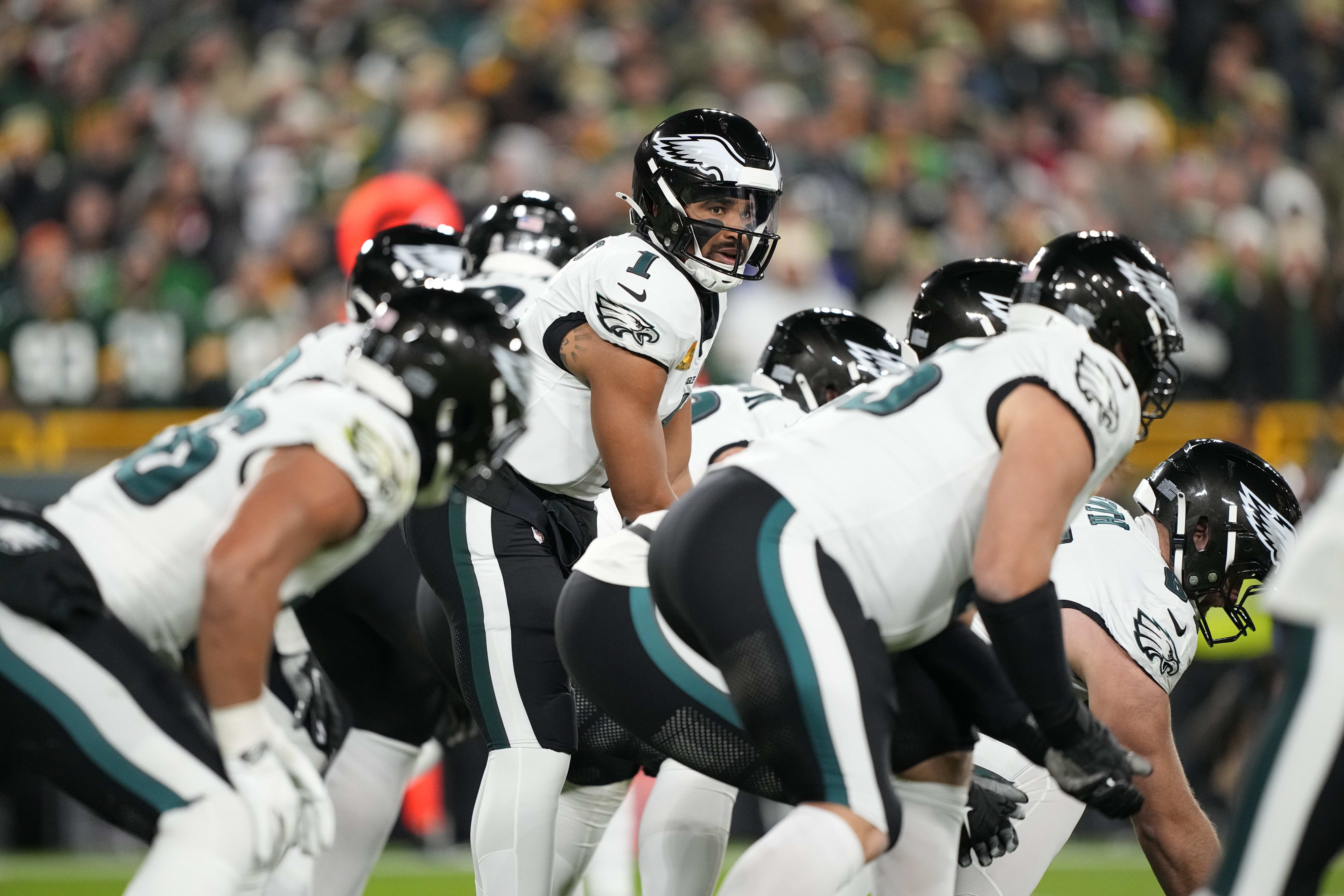 Philadelphia Eagles quarterback Jalen Hurts (1) under center against the Green Bay Packers in the first half at Lambeau Field.
