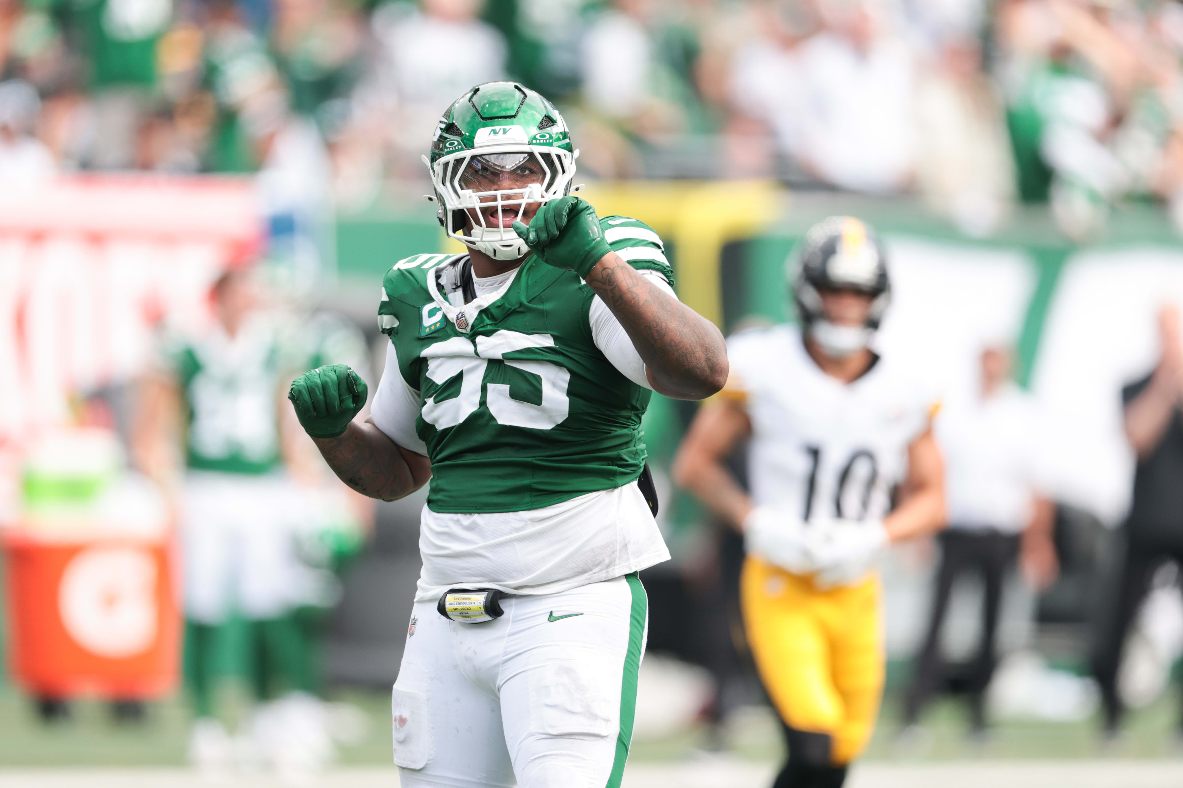 Sep 7, 2025; East Rutherford, New Jersey, USA; New York Jets defensive tackle Quinnen Williams (95) celebrates a defensive stop during the fourth quarter against the Pittsburgh Steelers at MetLife Stadium. 
