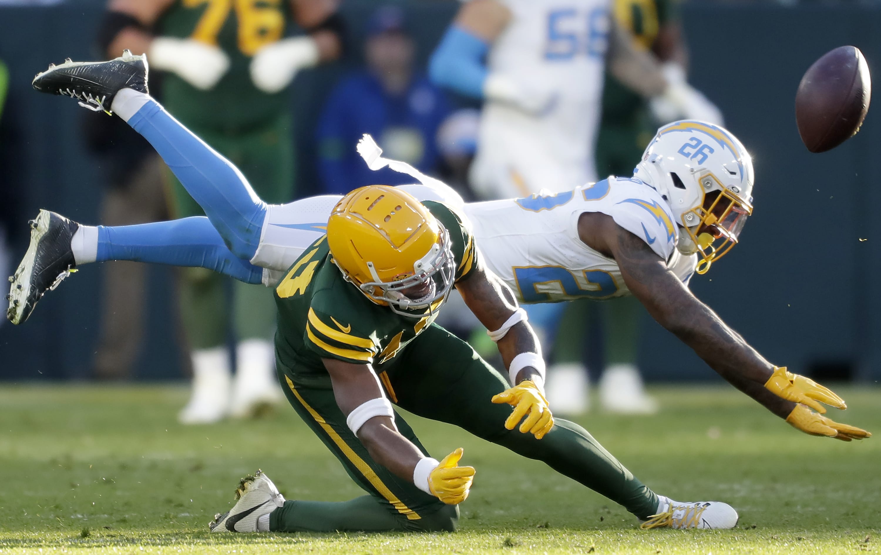 Nov 19, 2023; Green Bay, Wisconsin, USA; Los Angeles Chargers cornerback Asante Samuel Jr. (26) in called for pass interference on a throw to Green Bay Packers wide receiver Dontayvion Wicks (13) at Lambeau Field.
